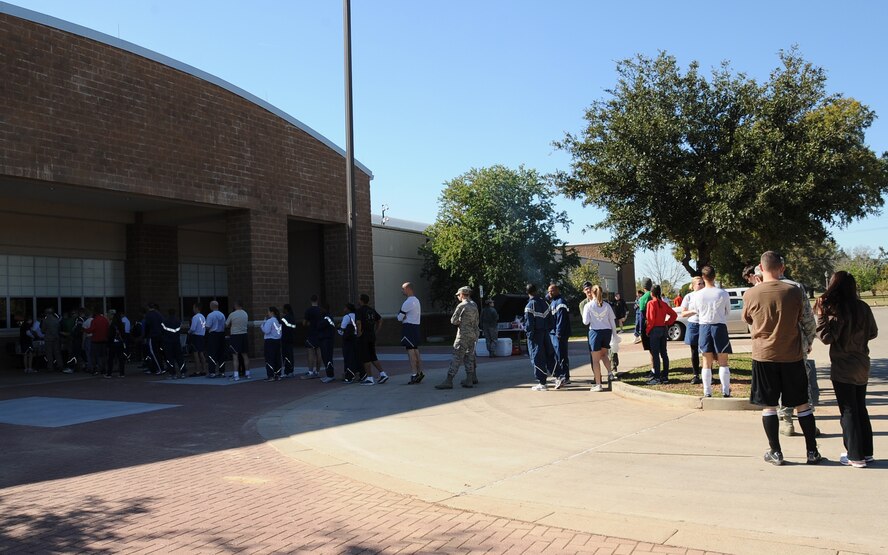 Airmen wait in line for food and beverages during the 2012 Sports Day on Barksdale Air Force Base, La., Nov. 16. Local vendors contributed to Sports Day by providing Airmen food and beverages. (U.S. Air Force photo/Airman 1st Class Benjamin Gonsier)(RELEASED)
