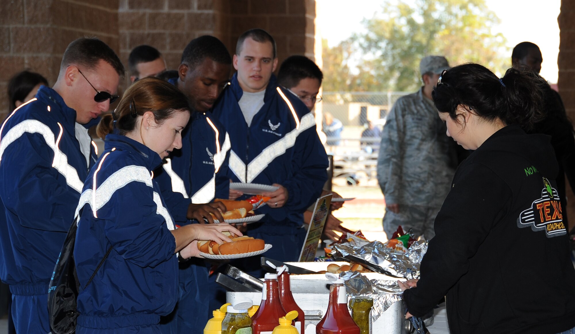 Airmen receive food from a local vendor during the 2012 Sports Day on Barksdale Air Force Base, La., Nov. 16. Local vendors contributed to Sports Day by providing Airmen food and beverages. (U.S. Air Force photo/Airman 1st Class Benjamin Gonsier)(RELEASED)
