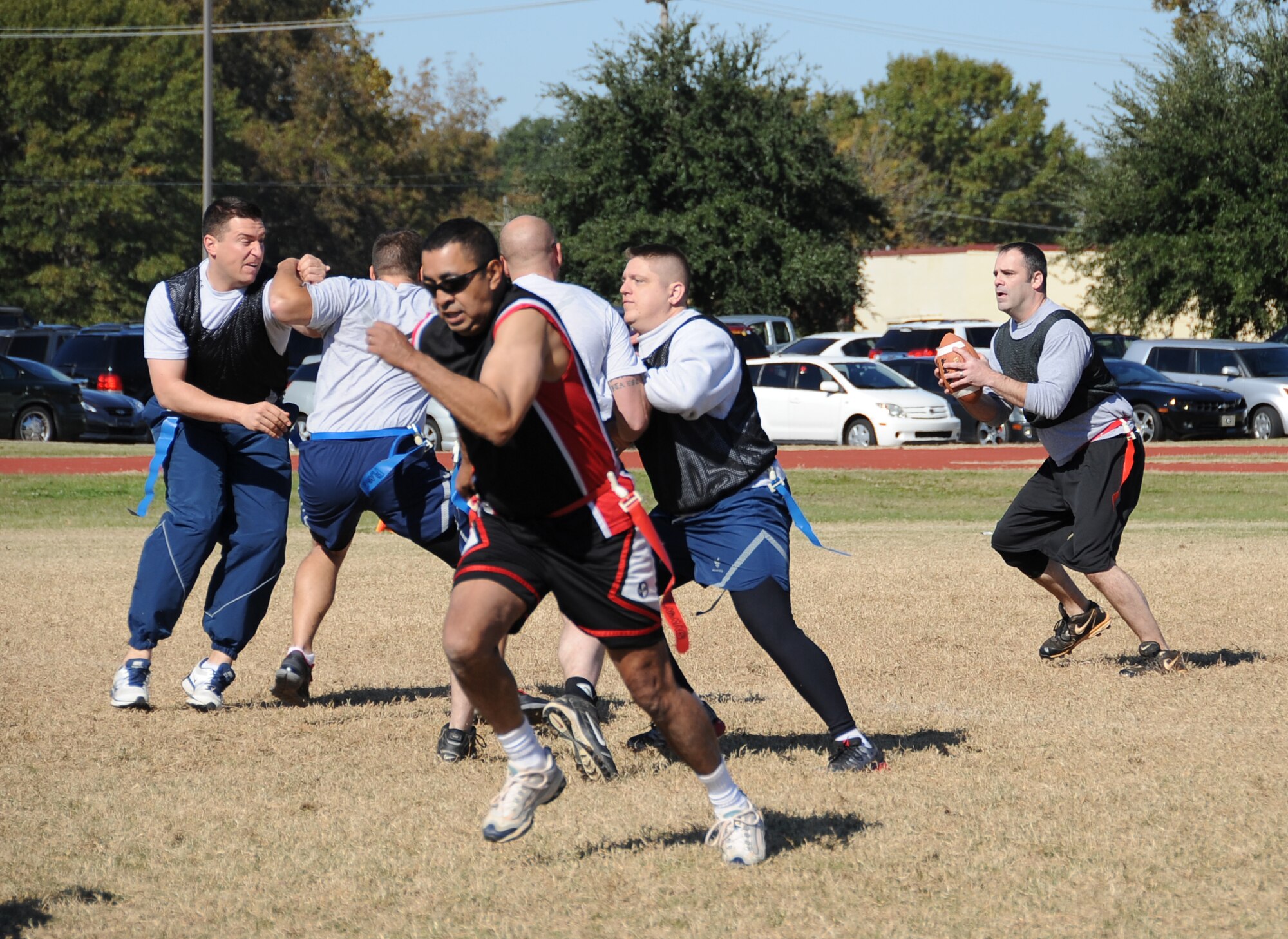 Barksdale Airmen participate in a flag football game during the 2012 Sports Day on Barksdale Air Force Base, La., Nov. 16. Sports Day gave Airmen the opportunity to compete against other squadrons in friendly competition to build teamwork and increase the awareness of fitness. (U.S. Air Force photo/Airman 1st Class Benjamin Gonsier)(RELEASED)