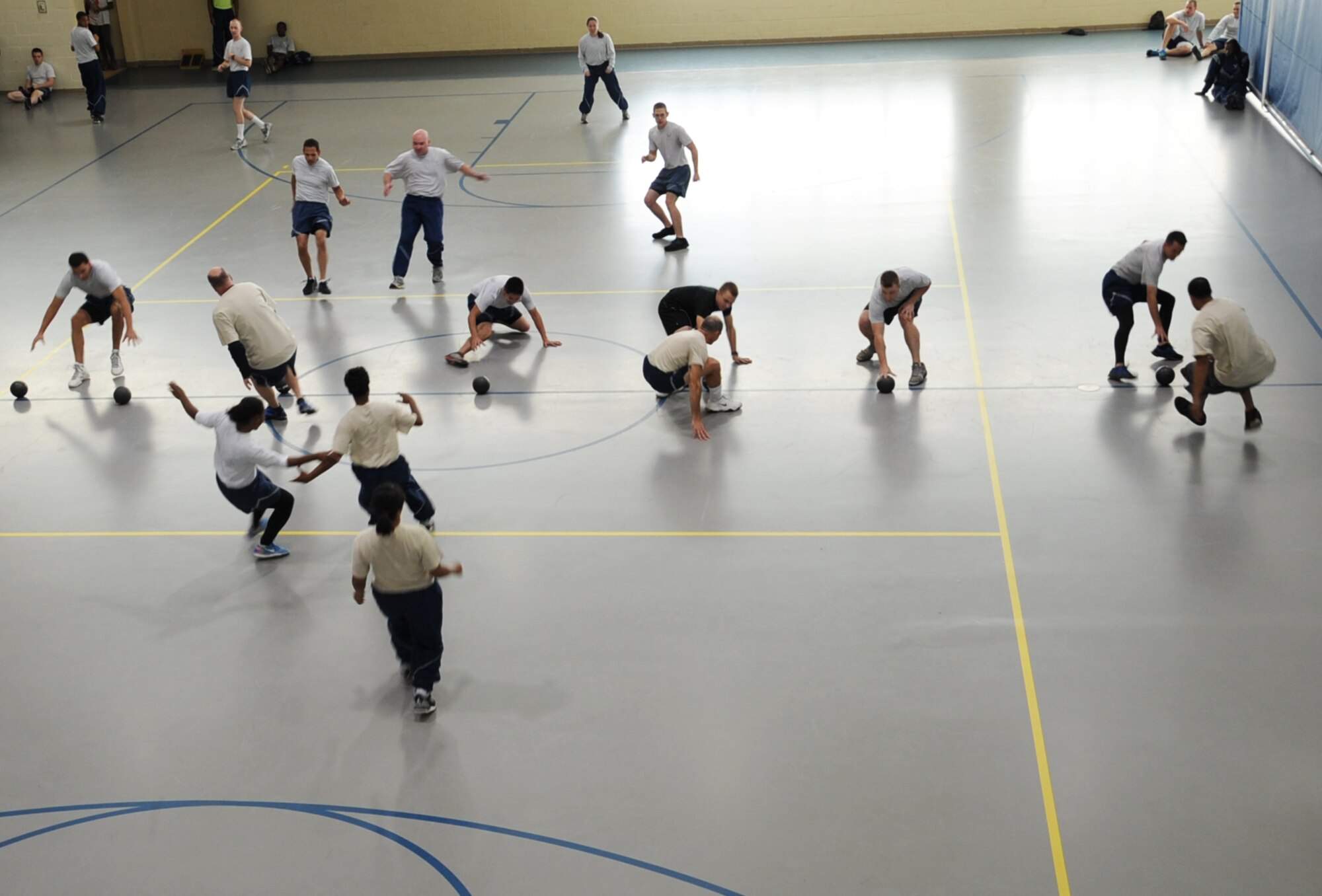 Teams face off in a dodgeball tournament during the 2012 Sports Day on Barksdale Air Force Base, La., Nov. 16. Sports day was designed to improve team work and help increase the awareness of fitness, sports programs and boost morale. (U.S. Air Force photo/Senior Airman Sean Martin)(RELEASED)