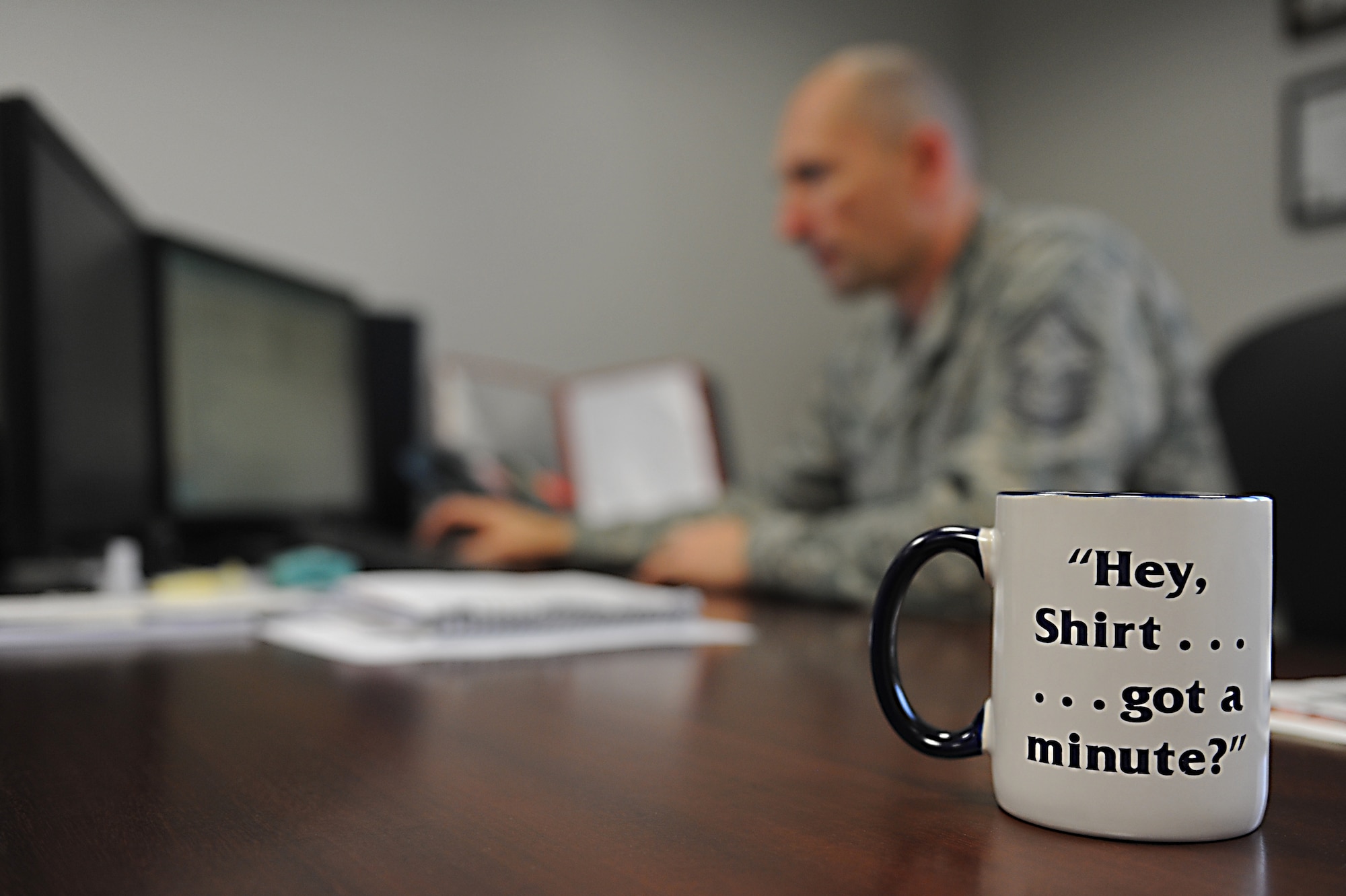 Senior Master Sgt. Charles Doan, 86th Medical Group first sergeant, executes his 'first shirt' duties while responding to emails on his computer on Ramstein Air Base, Germany, Nov. 16, 2012. The first sergeants use knowledge, experience and skill to guide Airmen in the right direction around the Air Force. (U.S. Air Force photo/Airman 1st Class Holly Cook)