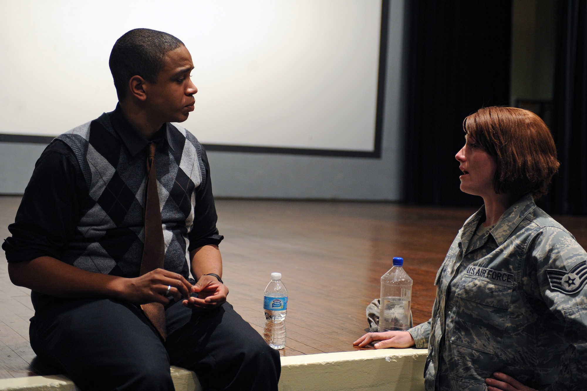 Jordan Burnham, public speaker, and U.S. Air Force Staff Sgt. Jaclyn Sporcic, 911th Air Refueling Squadron crew chief, talk at the base theatre on Seymour Johnson Air Force Base, N.C., Nov. 13, 2012. After his presentation on mental health, Burnham opened the floor to questions and comments. (U.S. Air Force photo/Airman 1st Class John Nieves Camacho/Released)