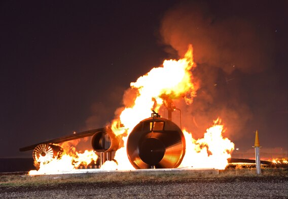 Westover's Fire Deptartment conducts a nighttime exercise as part of annual training requirements. Earlier this year, Air Force Reserve Command announced that the Westover Fire Dept. earned best in the command -- achieving the highest degree of excellence in mission support and fire protection management. (U.S. Air Force photo by SrA. Kelly Galloway)
