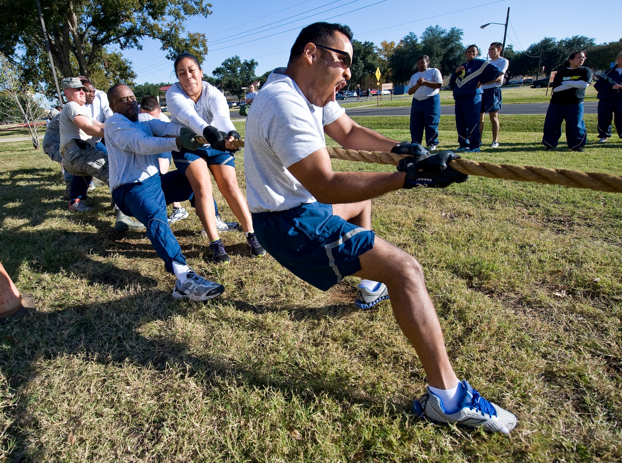Airmen from the 2nd Communications Squadron compete in a tug-of-war match during the 2012 Sports Day on Barksdale Air Force Base, La., Nov. 16. This annual event gives Airmen the opportunity to participate in several individual and team sports throughout the day boosting team morale. (U.S. Air Force photo/Staff Sgt. Chad Warren)(RELEASED)