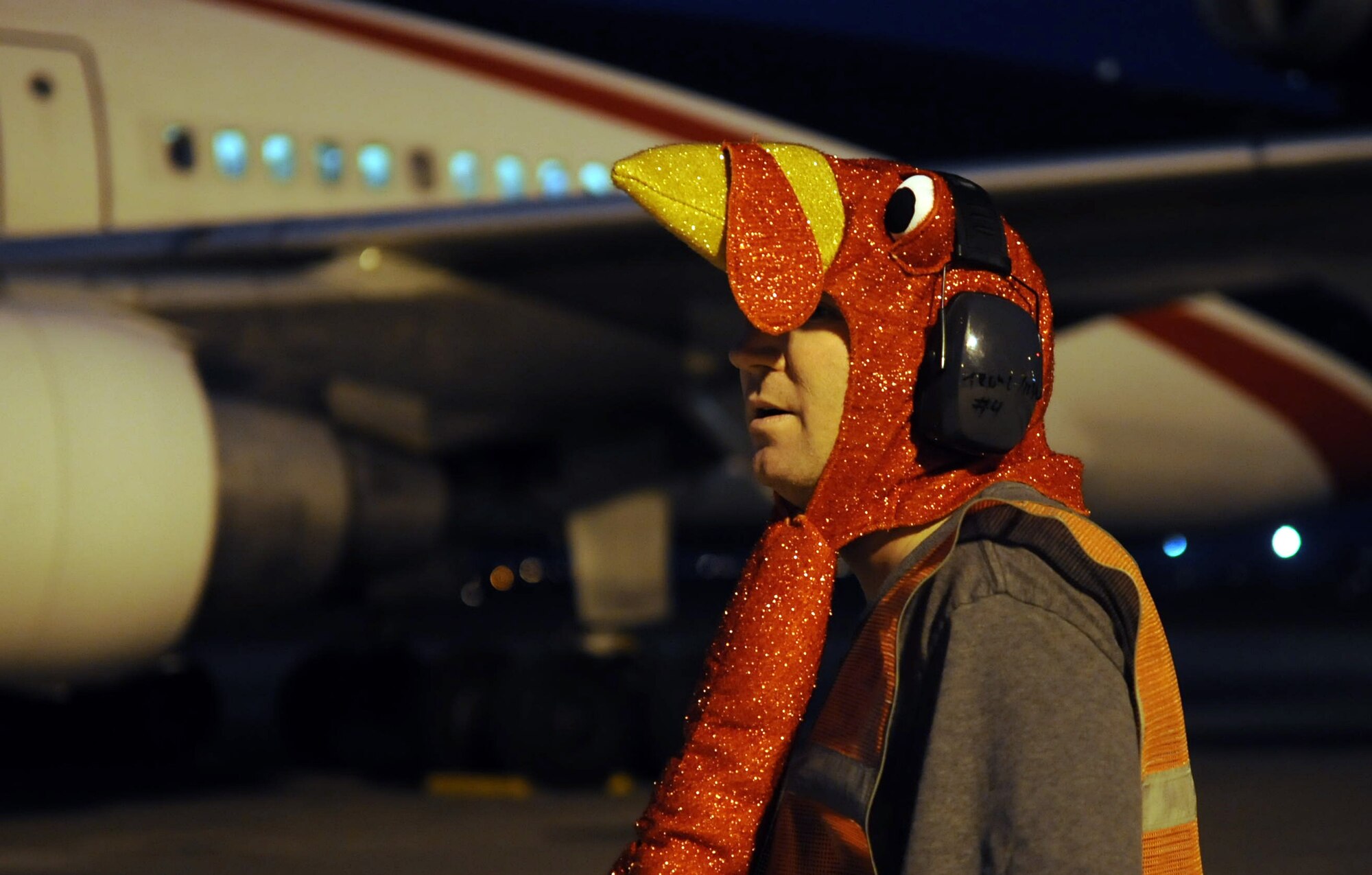 Tech. Sgt. Michael Nix, 728th Air Mobility Squadron assistant section chief, waits for the Patriot Express to unboard dressed as a turkey to bring some Thanksgiving cheer as it stops at Incirlik Air Base, Turkey Nov. 16, 2012. The jet stopped at Incirlik to change out the air crew, refuel and drop off new arrivals before continuing on to the deployment location. (U.S. Air Force photo by Senior Airman Daniel Phelps/Released)
