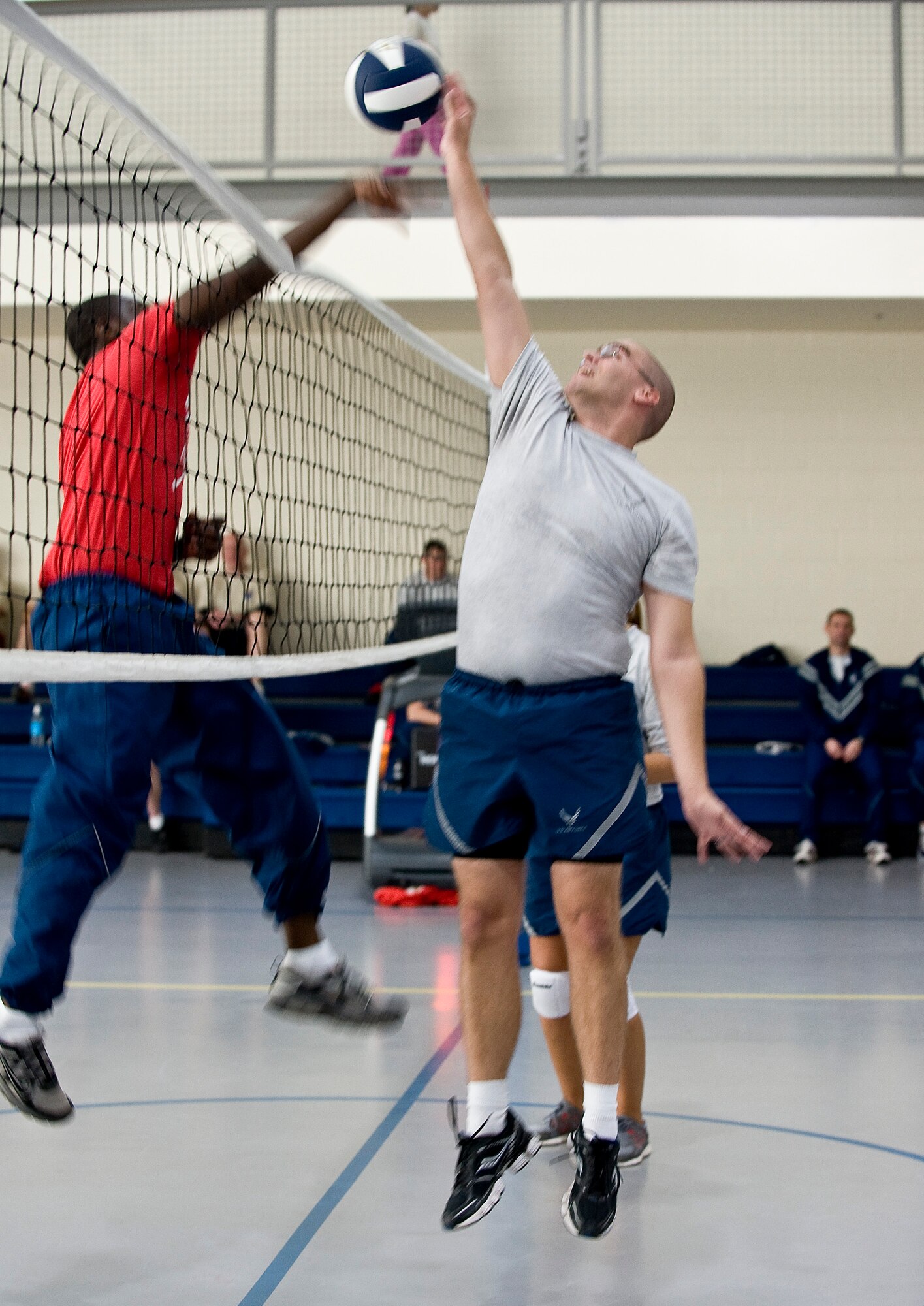Airmen battle for a point during a volleyball match on Barkdale Air Force Base, La., Nov. 16. The match was part of the 2012 Sports Day, an annual event that gives Airmen the opportunity to participate in several individual and team sports throughout the day focusing on teamwork and boosting morale. (U.S. Air Force photo/Staff Sgt. Chad Warren)(RELEASED)