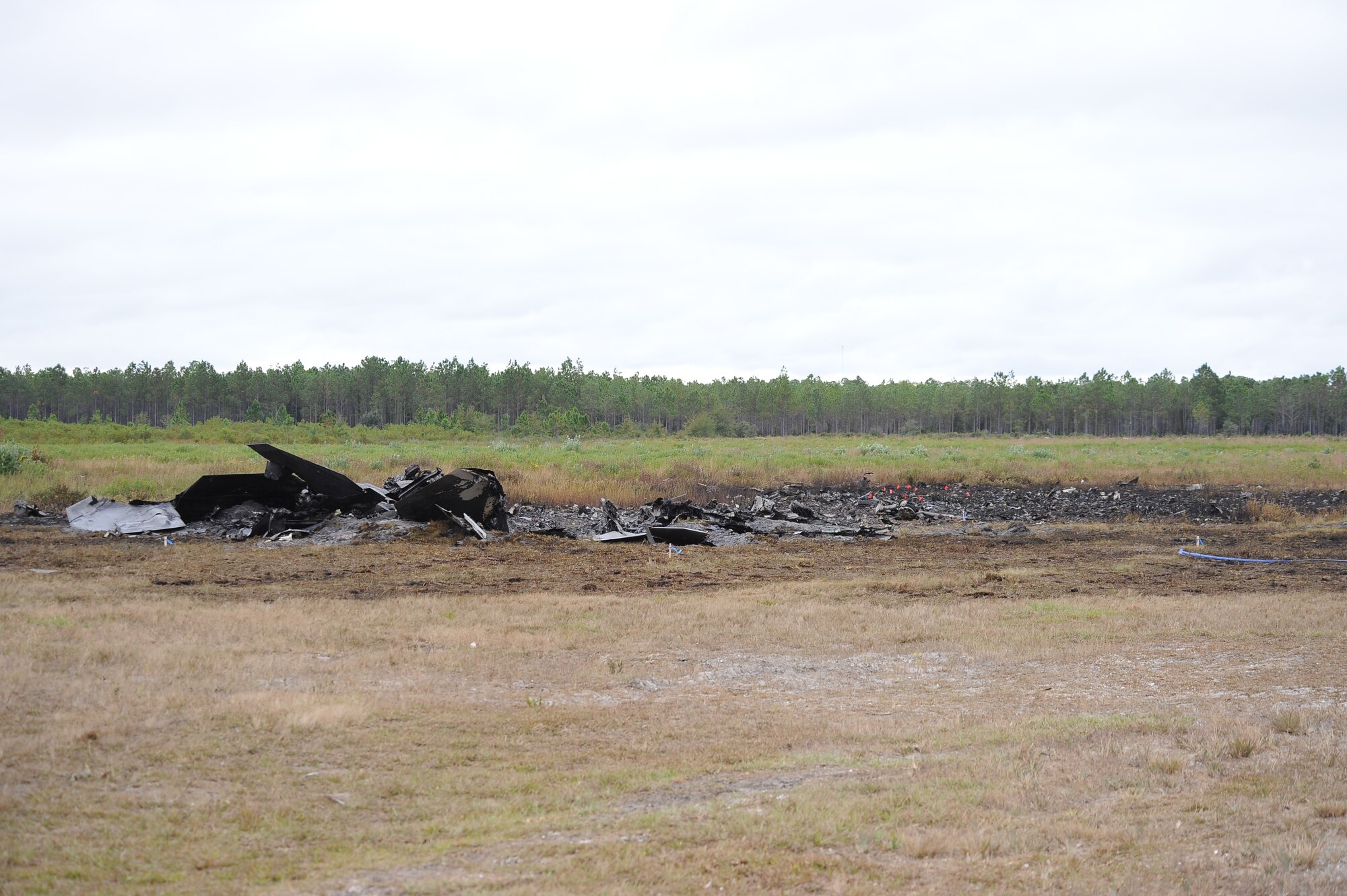 Wreckage of an F-22 Raptor remains at the crash site on Tyndall Air Force Base, Fla., Nov. 15, 2012. Officials with the 325th Fighter Wing are continuing to investigate and secure the scene. The pilot safely ejected from the aircraft and first responders were on the scene in less than two minutes. (U.S. Air Force photo/Lisa Norman)