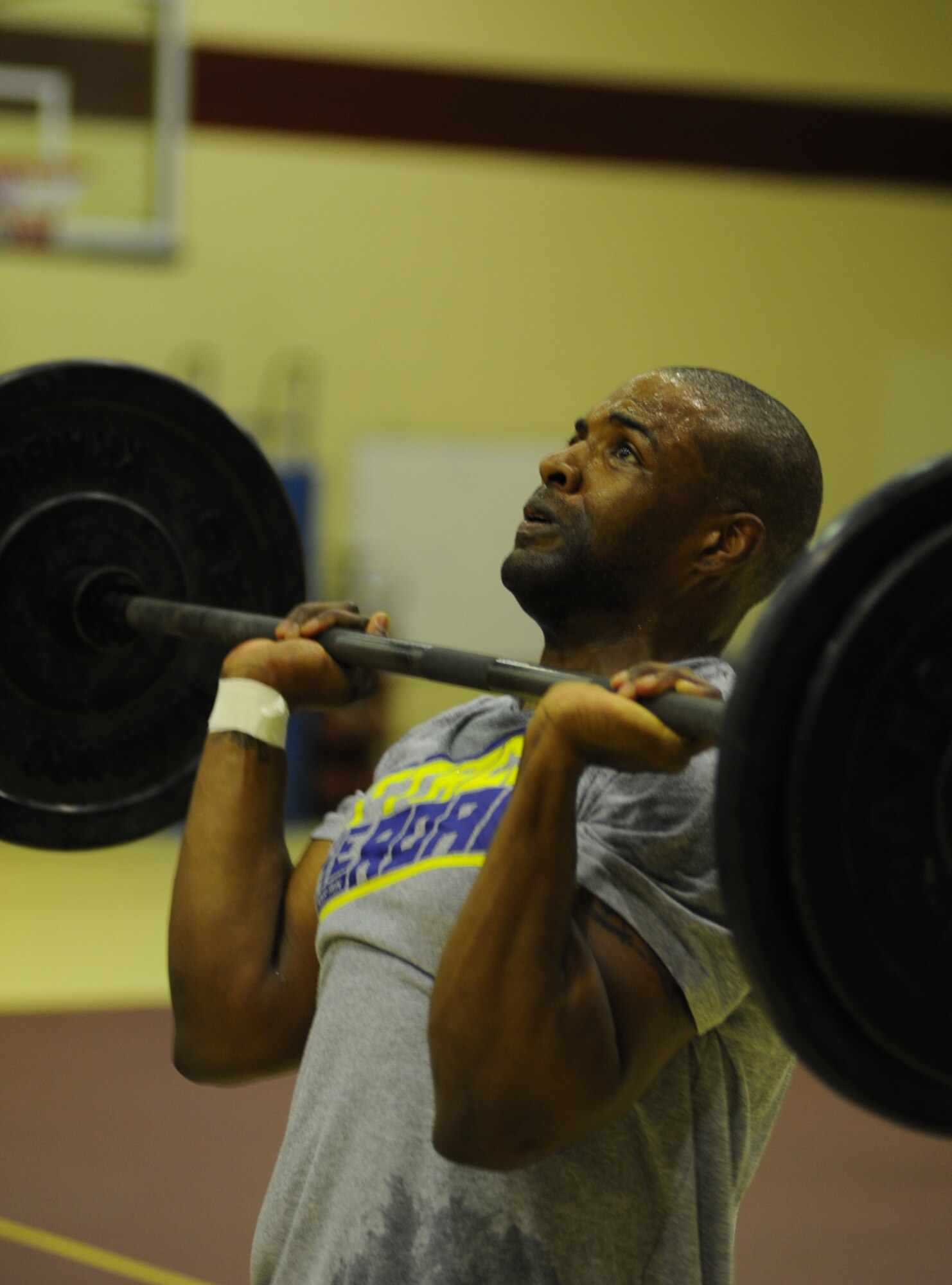 Cameron Freeman, 39th Security Forces Squadron, takes part in the push presses portion of the Lik Fit Challenge Nov. 14, 2012, at Incirlik Air Base, Turkey. This exercise was one of five that participants endured each round. Freeman took first place in the men's division. (U.S. Air Force photo by Staff Sgt. Lana Mills/Released)
