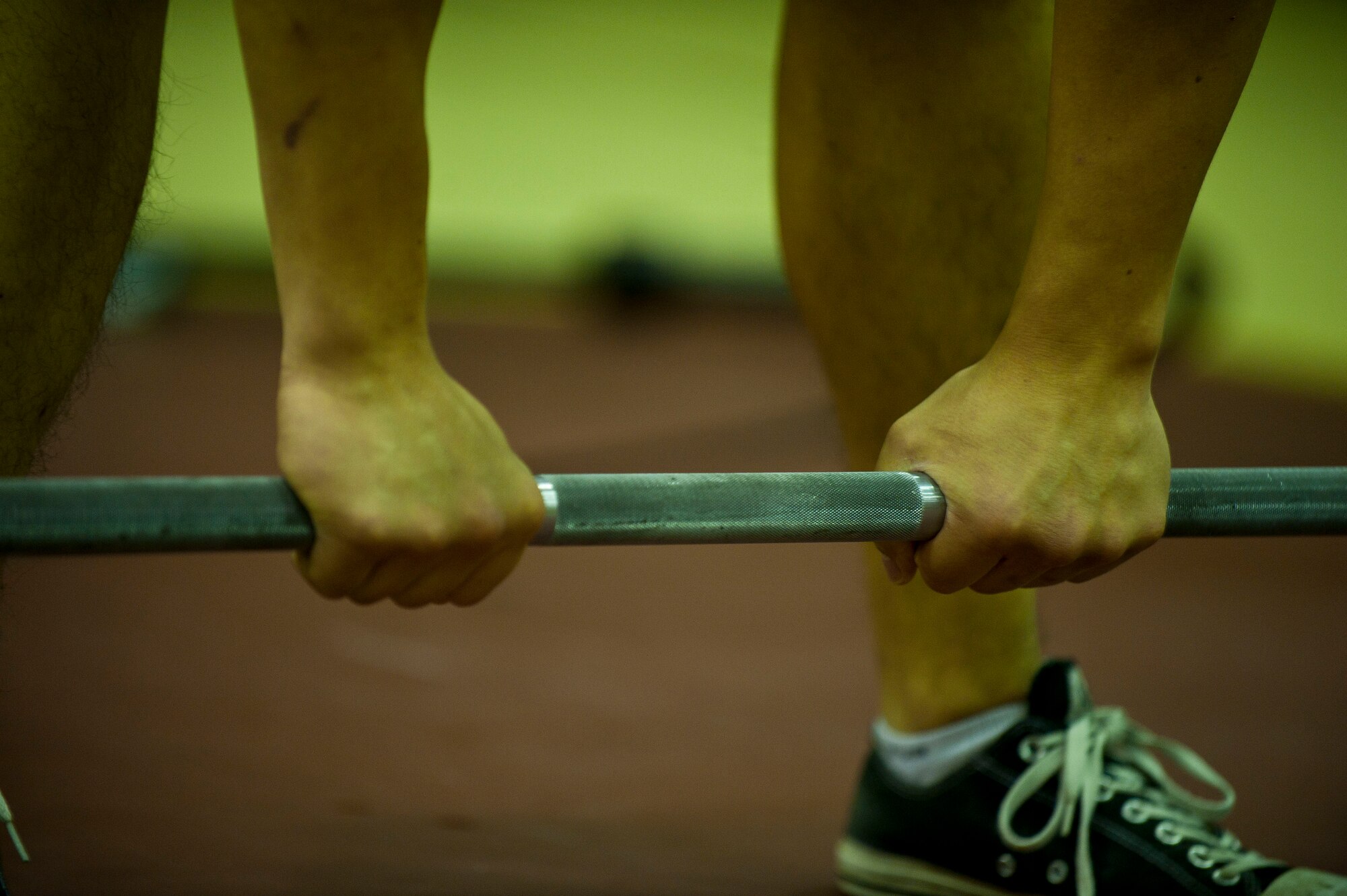 A participant prepares for the sumo deadlift high pulls portion of the Lik Fit Challenge Nov. 14, 2012, at Incirlik Air Base, Turkey. Other exercises at the event consisted of wallball shots, push presses, plyo-box jumps and rowing. (U.S. Air Force photo by Senior Airman Clayton Lenhardt/Released)