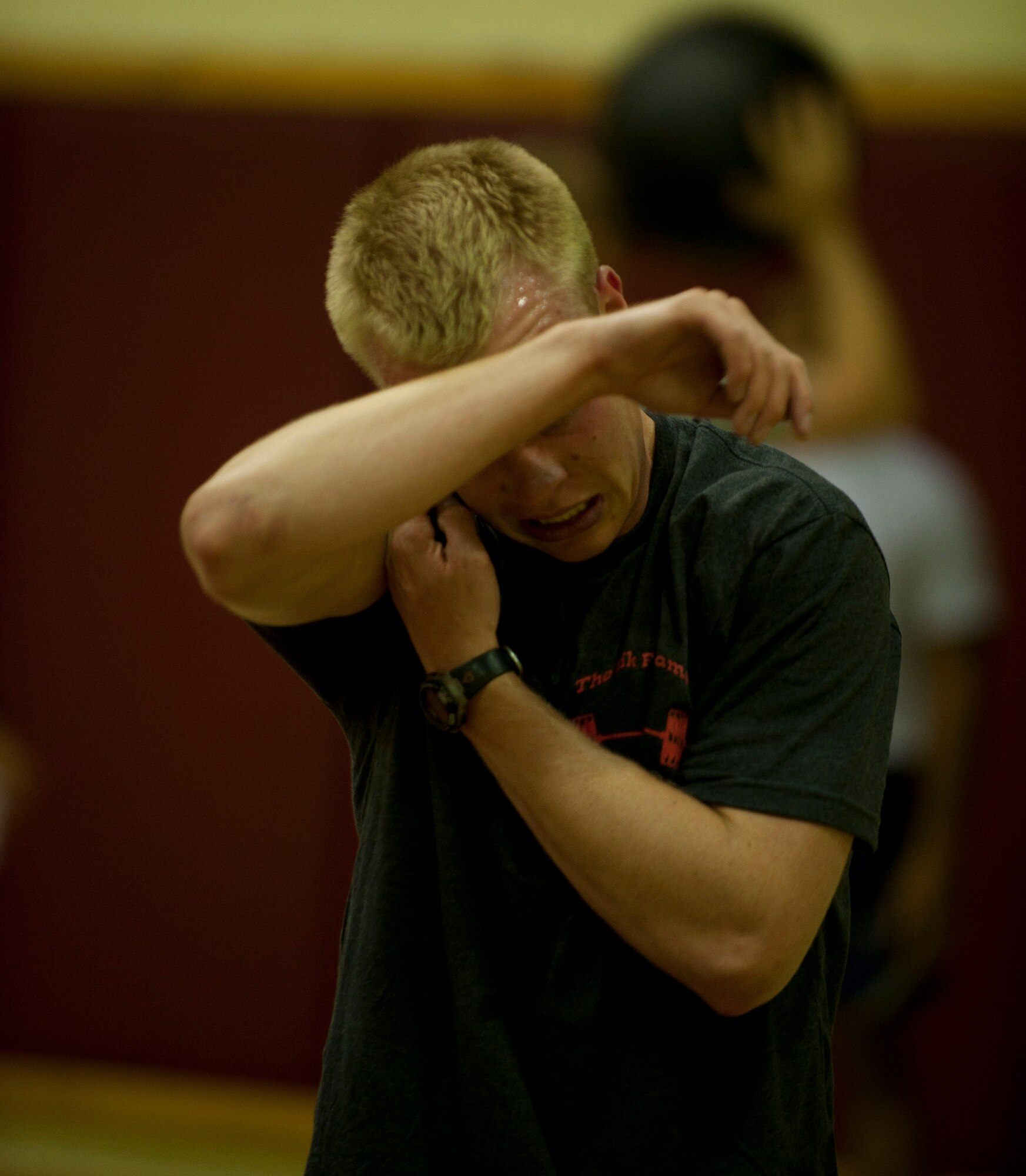 Nathan Thomsen, 39th Civil Engineer Squadron, takes a moment to wipe sweat off of his head during the Lik Fit Challenge Nov. 14, 2012, at Incirlik Air Base, Turkey. Participants went through three five-minute rounds to earn points by completing exercises with a one-minute rest period after each round. (U.S. Air Force photo by Senior Airman Clayton Lenhardt/Released)