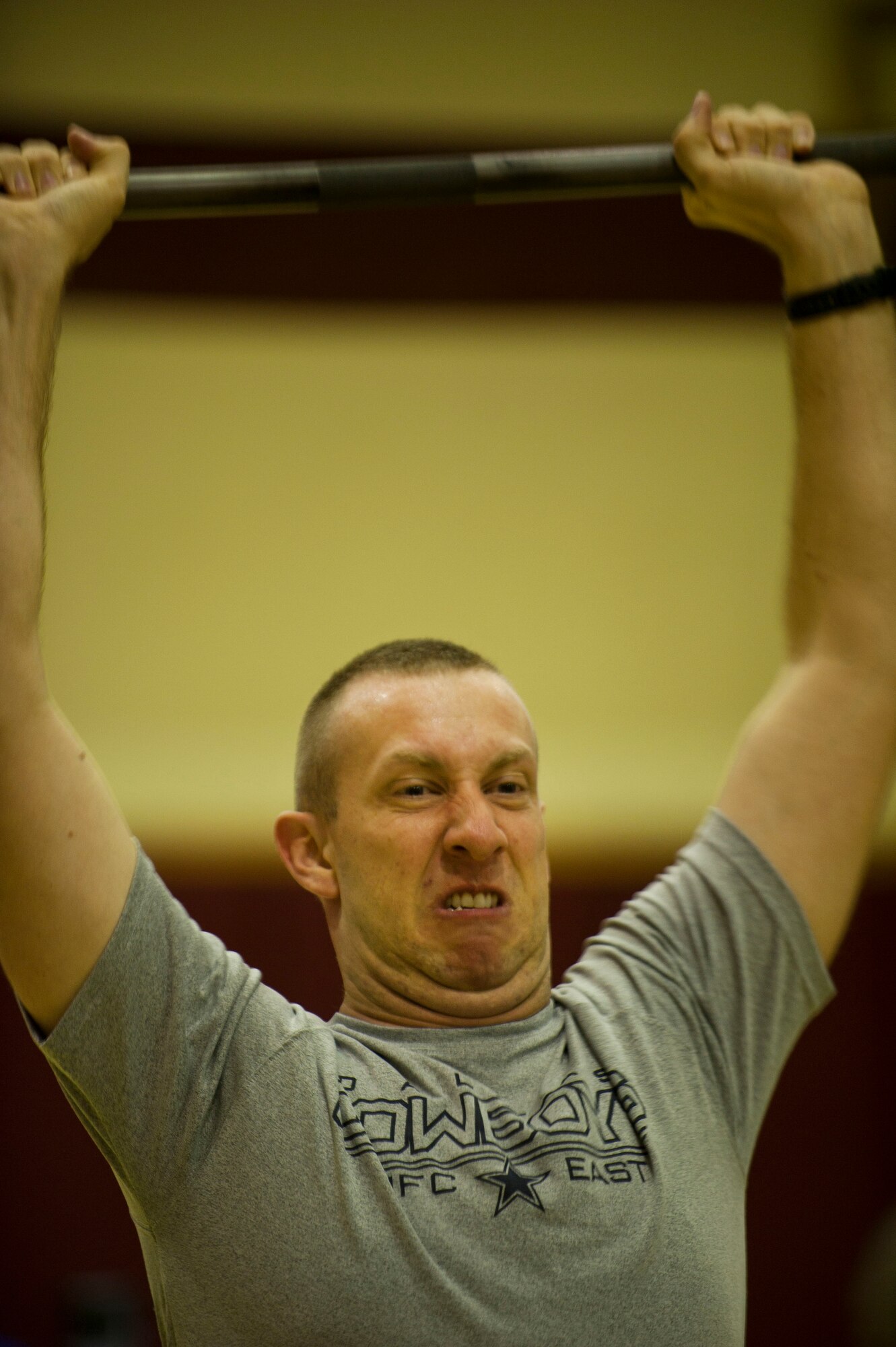Scott McCoy, 39th Contracting Squadron, participates in the push presses portion of the Lik Fit Challenge Nov. 14, 2012, at Incirlik Air Base, Turkey. Other exercises at the event consisted of wallball shots, sumo deadlift high pulls, plyo-box jumps and rowing. (U.S. Air Force photo by Senior Airman Clayton Lenhardt/Released)