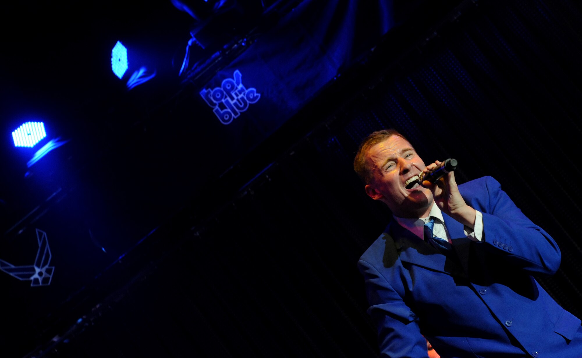 KADENA AIR BASE, Japan--Lieutenant Joseph Mitchell, Tops in Blue vocalist, sings during the Tops in Blue performance at the Keystone Theater on Kadena Air Base, Japan, Nov. 16, 2012. This year’s Tops in Blue performance entitled “Listen” is being performed for service members throughout the United States as well as 20 countries worldwide. (U.S. Air Force photo/Staff Sgt. Laszlo Babocsi)