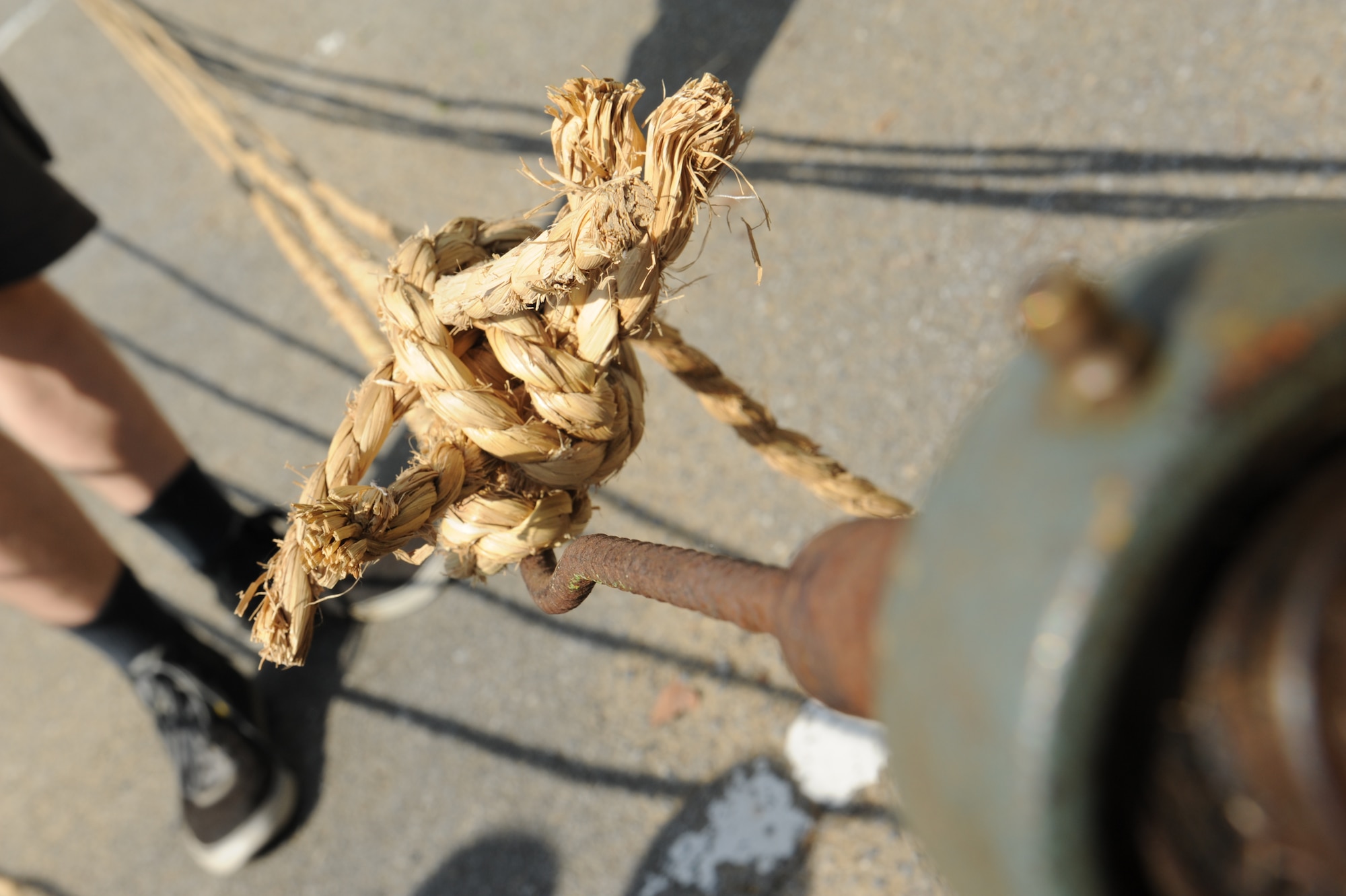 Volunteers prepare ropes for the International Tug-of-War in Okinawa City, Japan, Nov. 18, 2012. In preparation of the International Tug-of-War in Okinawa City, Japan, Nov. 24, five ropes are twisted together then joined with two other ropes to create a gigantic rope that will be used for the event. (U.S. Air Force photo/Airman 1st Class Malia Jenkins)