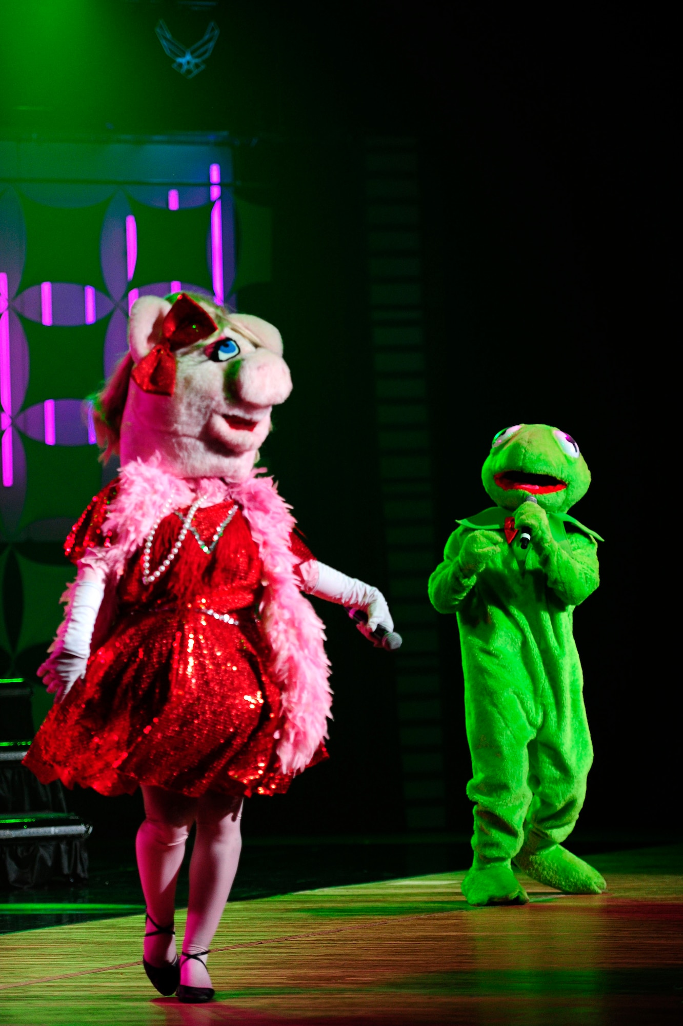 Tops In Blue vocalists dressed as Kermit the Frog and Miss Piggy sing a duet for the Misawa Air Base community and Japanese citizens, Nov. 14, 2012, at the Misawa City Civic Center, Japan. Tops In Blue, the Air Force’s premiere entertainment showcase comprised of more than 35 Airmen, provided entertainment for more than 800 Misawa Air Base residents and Japanese citizens. More than 35 Airmen, who comprise the Air Force’s premiere entertainment showcase, set up more than 60,000 pounds of staging, lighting, audio, video and special effects equipment required for each performance. (U.S. Air Force photo by Staff Sgt. Jess Lockoski)