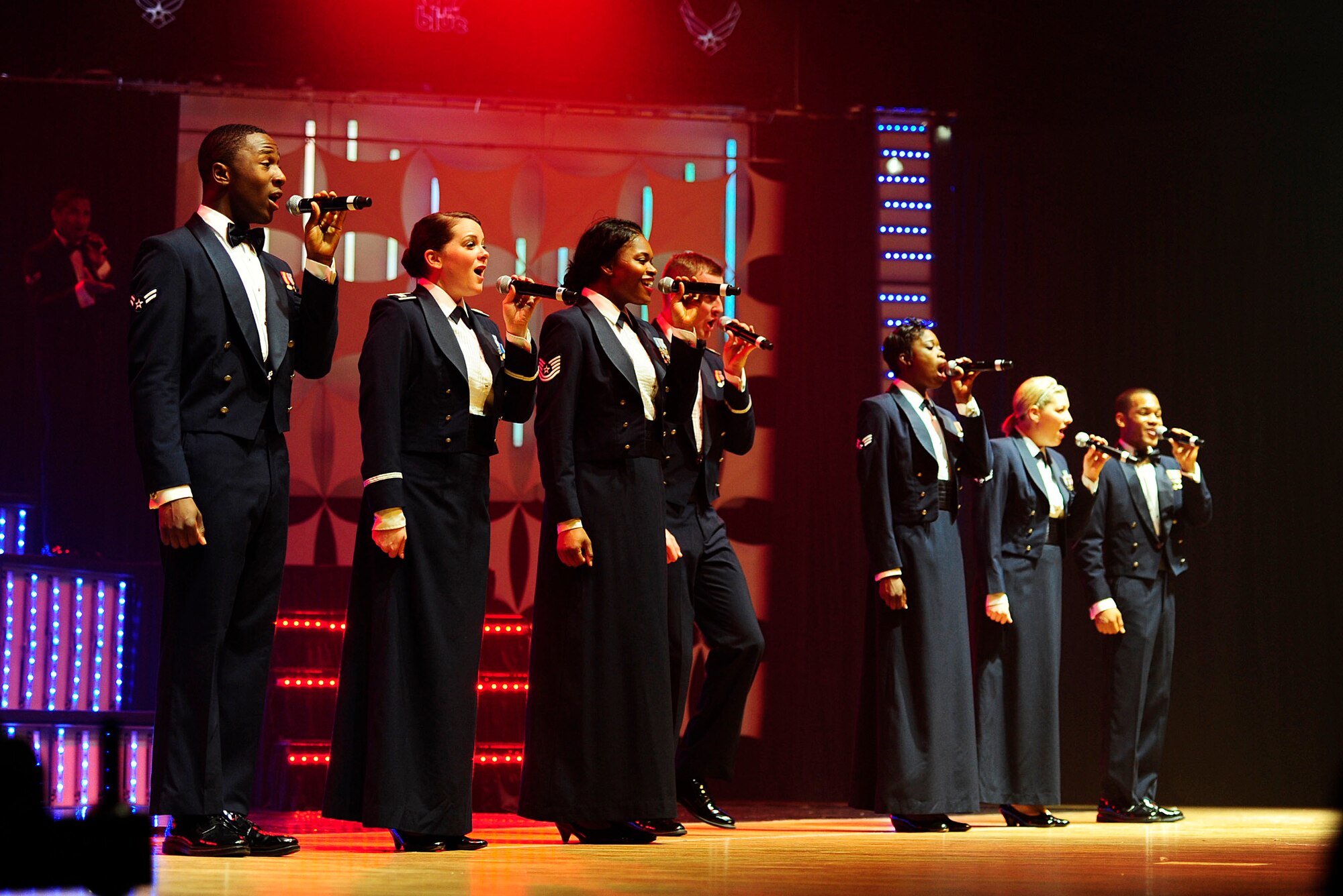 Airmen from Tops In Blue, the Air Force’s premiere entertainment showcase, sing a patriotic tune for the Misawa Air Base community and Japanese citizens, Nov. 14, 2012, at the Misawa City Civic Center, Japan. The Tops in Blue’s 2012 10-month traveling tour, entitled ‘Listen,’ features American rock, jazz, R&B, pop and country music, spanning several decades of top chart hits. (U.S. Air Force photo by Staff Sgt. Jess Lockoski)