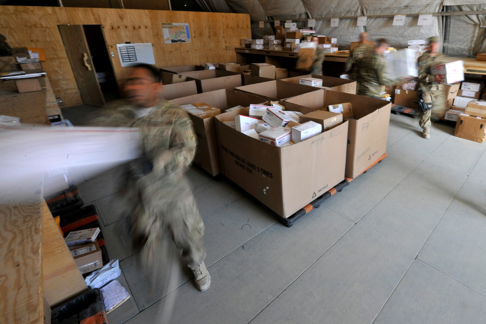 Airmen of the 455th Expeditionary Knowledge Operations Management office and the 455th Expeditionary Logistics Readiness Squadron sort boxes and envelopes of mail for personnel at Bagram Airfield, Afghanistan, Nov. 15, 2012.  More than 180,000 pounds of mail are sent to BAF personnel per month but averages will reach nearly 300,000 pounds during the holiday season. (U.S. Air Force photo/Senior Airman Chris Willis)