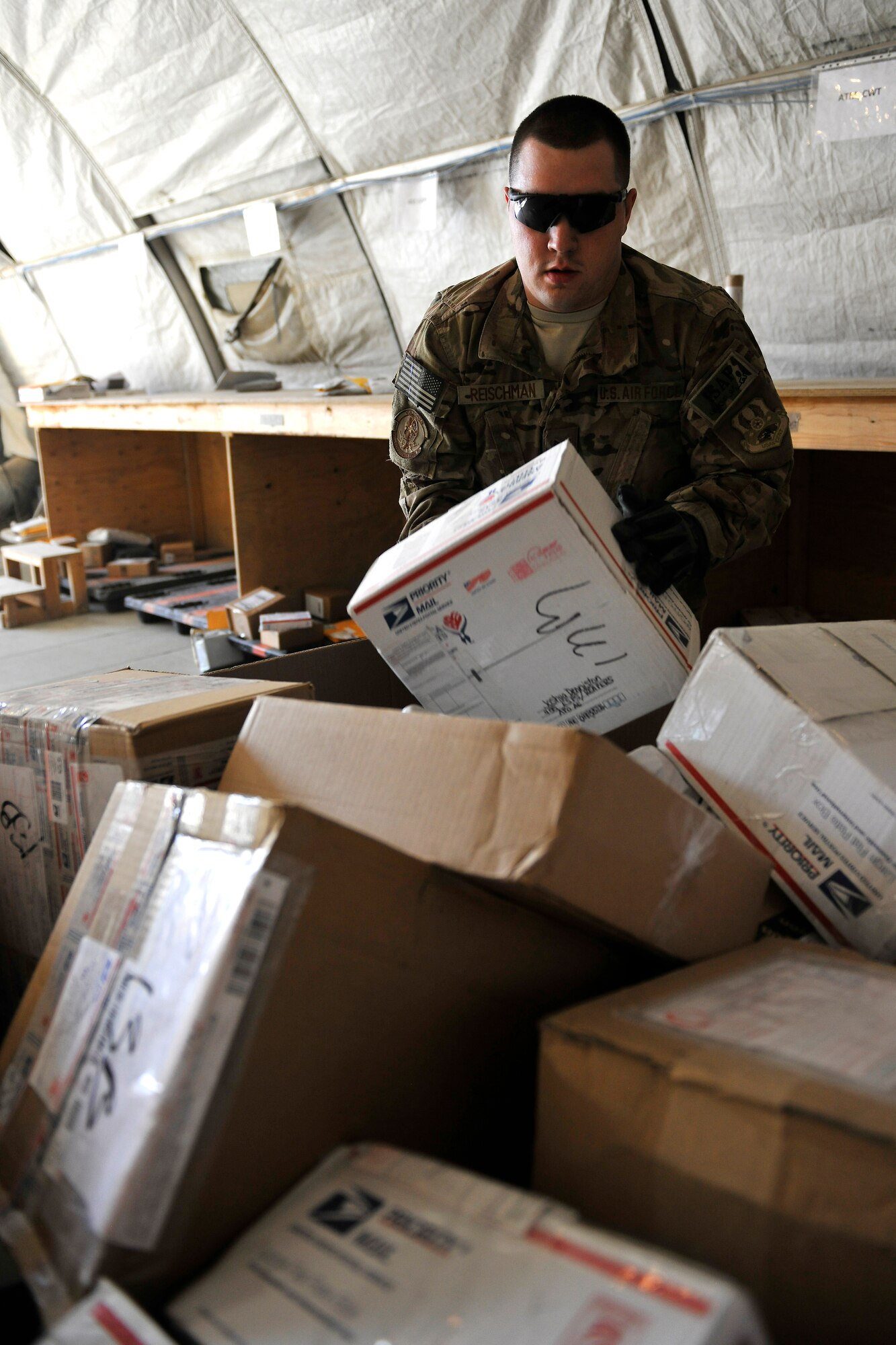 Senior Airman Zachary Reischman, a member of the 455th Expeditionary Knowledge Operations Management office, sorts mail for the entire wing at Bagram Airfield, Afghanistan, Nov. 15, 2012.  The KOM Office handles the sorting and delivery of the mail, as well as other functions like managing the Automated Military Postal System with accountable mail notifications. (U.S. Air Force photo/Senior Airman Chris Willis)