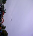 Two MV-22B Ospreys fly over the starting line of the 2012 Marine Corps Marathon as the last note of the National Anthem is played.  