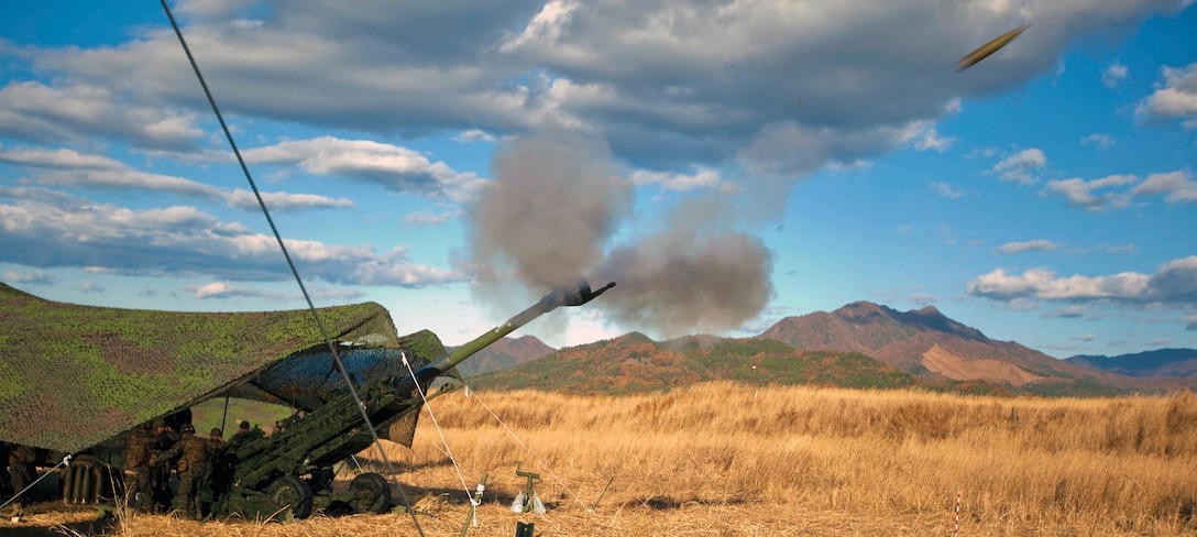 Marines fire an M777A2 155 mm howitzer during a demonstration for local government officials and media at the North Fuji Maneuver Area, Shizuoka prefecture, Japan, Nov. 13. The demonstration allowed Marines to showcase their proficiency to visitors attending the event as part of Artillery Relocation Training Program 12-3. Mike Battery is currently assigned to 3rd Battalion, 12th Marine Regiment, 3rd Marine Division, III Marine Expeditionary Force.