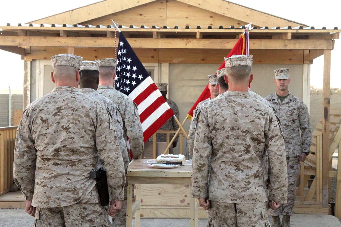 Marines with Special Operations Task Force West escort a birthday cake to the front of a ceremony on Camp Calero, Helmand province, Afghanistan, Nov. 10. Marines of SOTF-West held a birthday ceremony in honor of the 237th Marine Corps birthday. (U.S. Marine Corps photo by Sgt. Chadwick de Bree/Released)