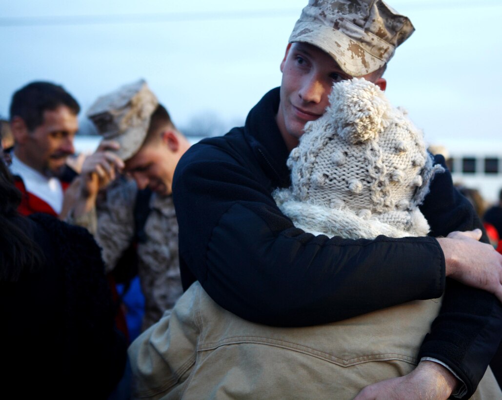 Lexington, Ky., native Lance Cpl. Nicholas Perry of Company E, 4th Tank Battalion, 4th Marine Division, hugs his mother Nov. 15, 2012, at Fort Knox, Ky., after returning home from a six-month deployment to Afghanistan.  Perry’s mother, Alexis Houge, said she felt a huge relief after finally being able to see her son again. (U.S. Marine Corps Photo by Cpl. Nana Dannsa-Appiah/Released)