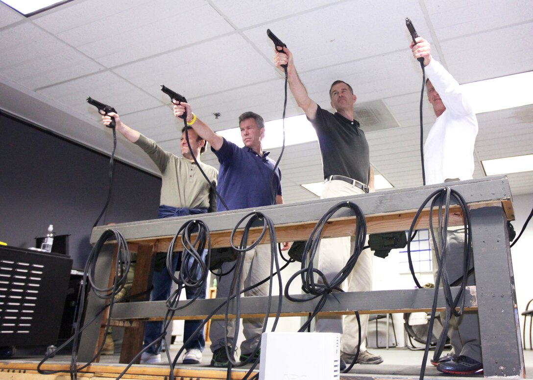 Members of the Young Presidents’ Organization and the World Presidents’ Organization fire weapons in an Indoor Simulated Marksmanship Trainer at Camp Pendleton, Calif., Nov. 16, 2012. The YPO and WPO are international associations of business leaders. The members who visited Camp Pendleton are from businesses in the Southern California area. They visited the base to learn how Marines train and to help create a bridge between the private sector and military.


