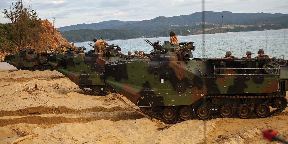 Marines conduct an amphibious landing at Camp Schwab in the authorized landing area Nov. 15 as part of Exercise Keen Sword 2013. "The primary goal of the assault amphibious vehicles during this operation was to provide a lift capability to the infantry and to conduct an amphibious assault," said Master Sgt. Frank Edling, the operations chief with AAV Company, Combat Assault Battalion, 3rd Marine Division, III Marine Expeditionary Force. The Marines and AAVs are with CAB and 2nd Battalion, 3rd Marine Regiment, which is assigned to 4th Marine Regiment, 3rd Marine Division. 