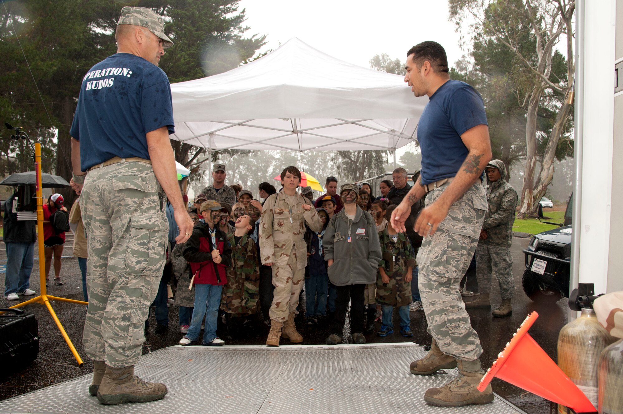 VANDENBERG AIR FORCE BASE, Calif. – Volunteers from the 30th Civil Engineer Squadron readiness department prepare to give gas masks to the children participating in the annual Kids Understanding Deployment Operations event at Cocheo Park here Saturday, Nov. 17, 2012. KUDOS simulated a deployment processing line for dependents to help them understand the deployment process their parents or guardians go through before deployment. (U.S. Air Force photo/Senior Airman Lael Huss)
