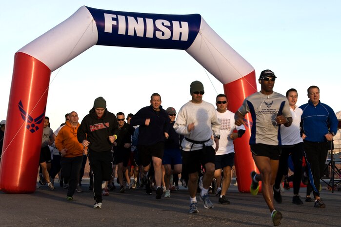 Military and family members start the Great American Smoke-Out Turkey Trot 5K run at the Warrior Fitness Center Nov. 15, 2012, at Nellis Air Force Base, Nev. The top three male and female finishers received a plaque of recognition and an AAFES gift card. (U.S. Air Force photo by Airman 1st Class Christopher Tam)