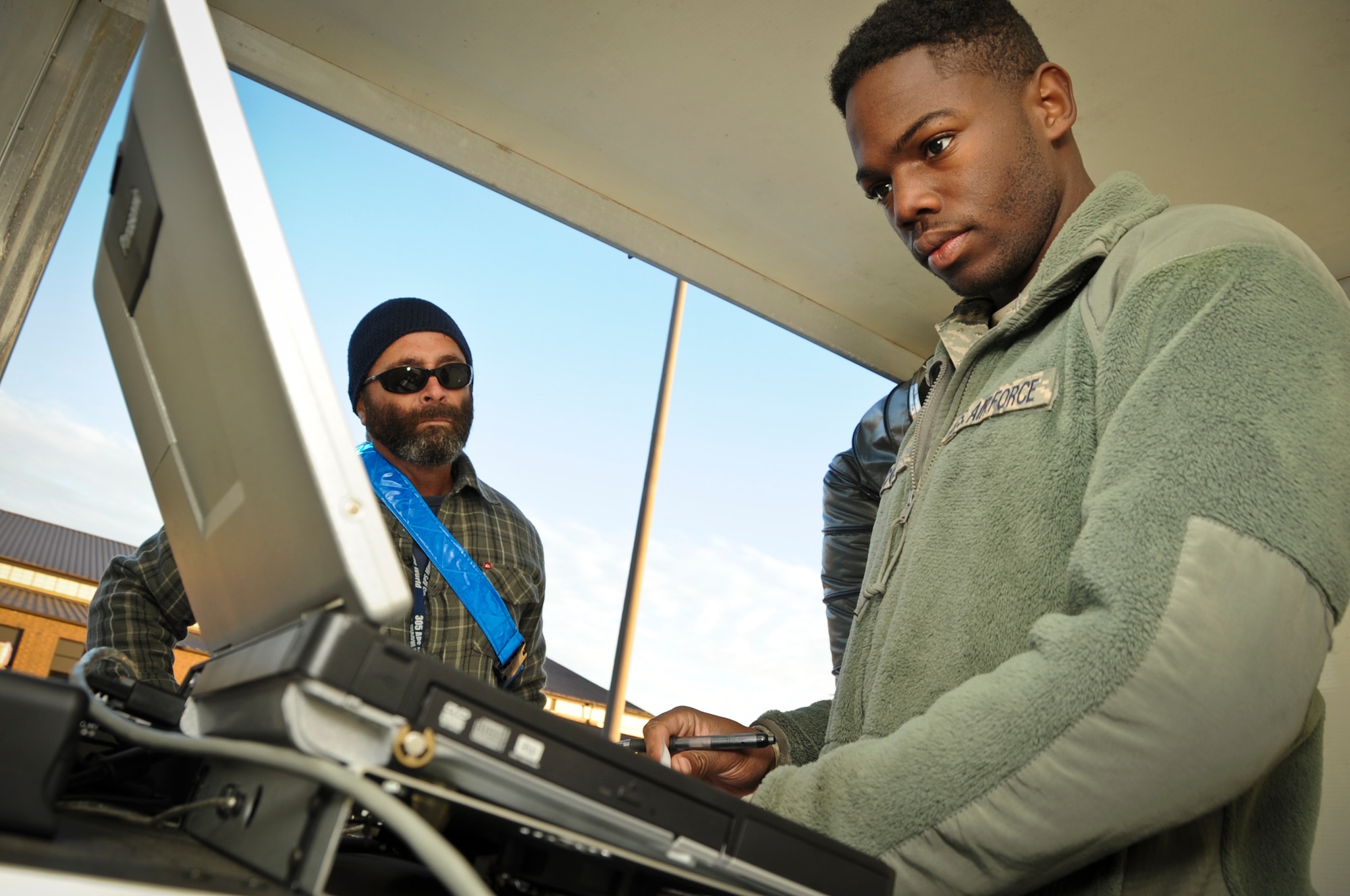 Senior Airman Marquis Cole, 305th Aerial Port Squadron aerial transportation specialist, monitors a Deployable Automated Cargo Measurement System computer Nov. 16, 2012, at Joint Base McGuire-Dix-Lakehurst, N.J., to determine if the truck’s approximate size and weight was calculated by DACMS. Cole is an Independence, La., native. (U.S. Air Force photo by Staff Sgt. David Carbajal/Released)