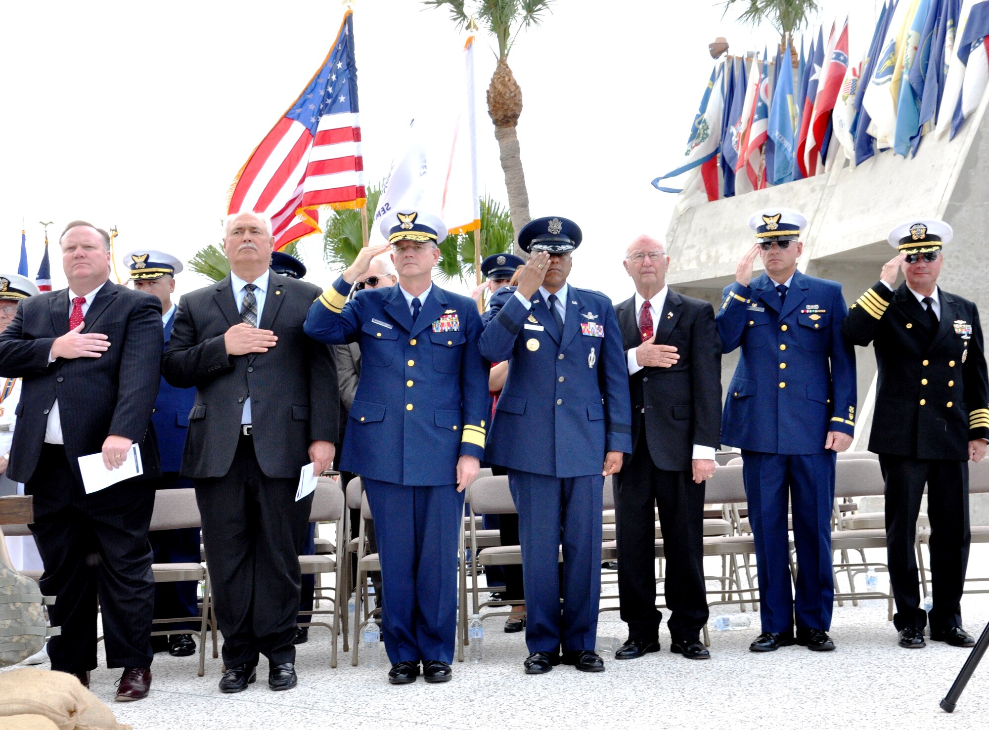 Dr. James Richie, BCC President, Coast Guard Rear Adm. (Ret) James Underwood, Rear Adm. William D. Baumgartner, Commander 7th Coast Guard District, Brig. Gen. Anthony Cotton, commander, 45th Space Wing, Dr. Maxwell King former president of BCC, Chief Warrant Officer 3 Charles Perry, commander, Cape Canaveral Coast Guard Station and Capt. J. P. Heatherington, commander Naval Ordnance Test Unit show respect to the Colors. 

Photo by 2nd Lt. Alicia Wallace.