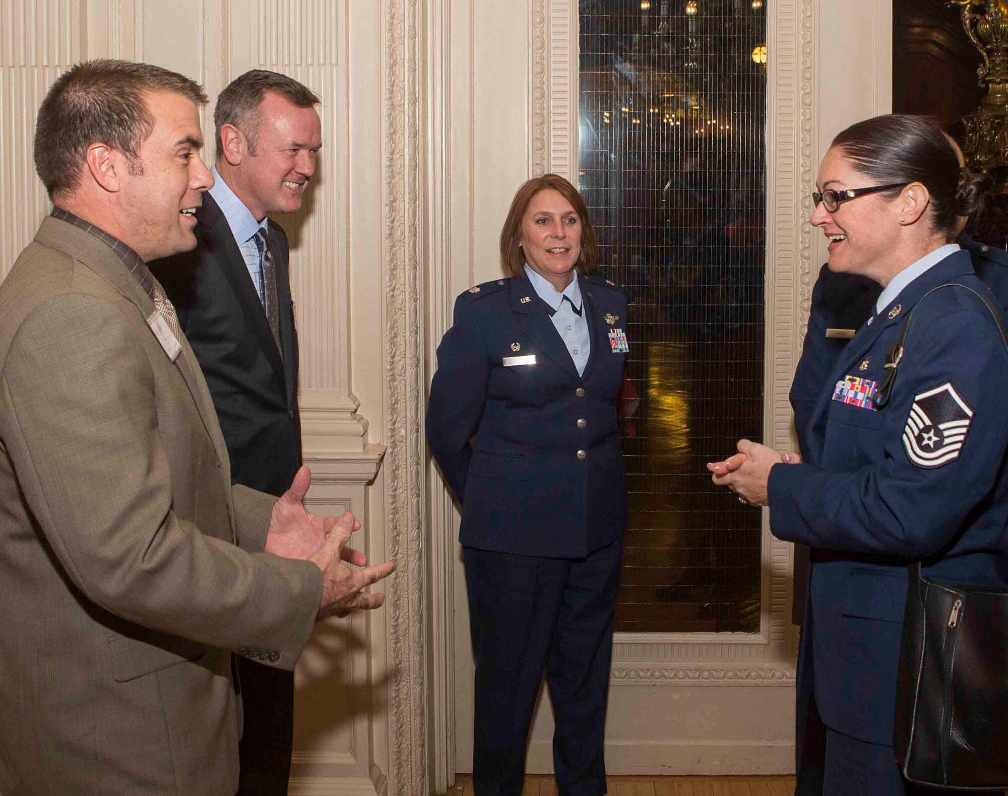 Master Sgt. Elizabeth Valentine congratulates Fredric Noller on being the first Physician Assistant student from Arcadia University to participate in a new training program between the University and Joint Base McGuire-Dix Lakehurst, N.J.. Sergeant Valentine, 360th Recruiting Group Health Profesions C-Flight chief, initiated an 8-week clinical rotation training program with Arcadia University that will allow students to work at the Family Health Clinic at McGuire. (photo courtesy of Arcadia University)
