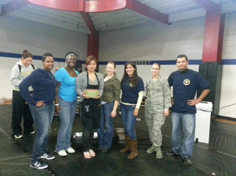 U.S. Air Force Airmen assigned to the 4th Fighter Wing pose with their award-winning chili during the Really Chili Challenge at the Family YMCA in Goldsboro, N.C., Oct. 27, 2012. The airman and non-commissioned officer professional organizations entered the competition for the first time and won second place. (Courtesy photo)