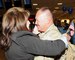 Master Sgt. Vincent Tanner greeted his wife, Roshell, as he returned from deployment at the Salt Lake City International Airport, Nov. 16. Tanner and eleven other members of the 130th Engineering Installation Squadron served a six-month deployment in support of Operation Enduring Freedom throughout several forward operating bases in Afghanistan. (U.S. Air Force photo by Senior Airman Lillian Harnden)(RELEASED)
