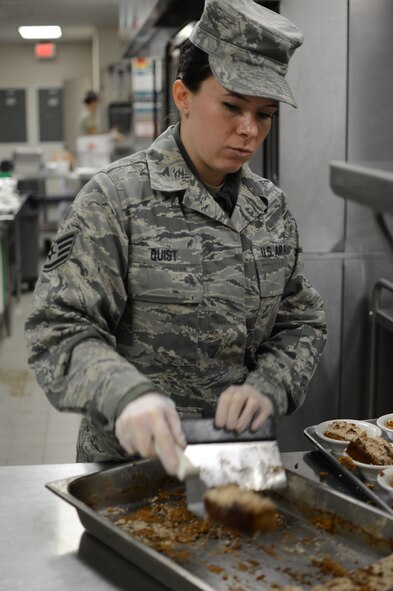ST. PAUL, Minn.  -Staff Sgt. Kathleen Quist, a services specialist with the 133 Airlift Wing Services Squadron, plates pumpkin bars to prepare for lunch Nov. 18, 2012 here.  Quist made the pumpkin bars earlier in preperation for a special Thanksgiving meal during the November drill.  (U.S. Air Force photo by Staff Sgt. Amy M. Lovgren)