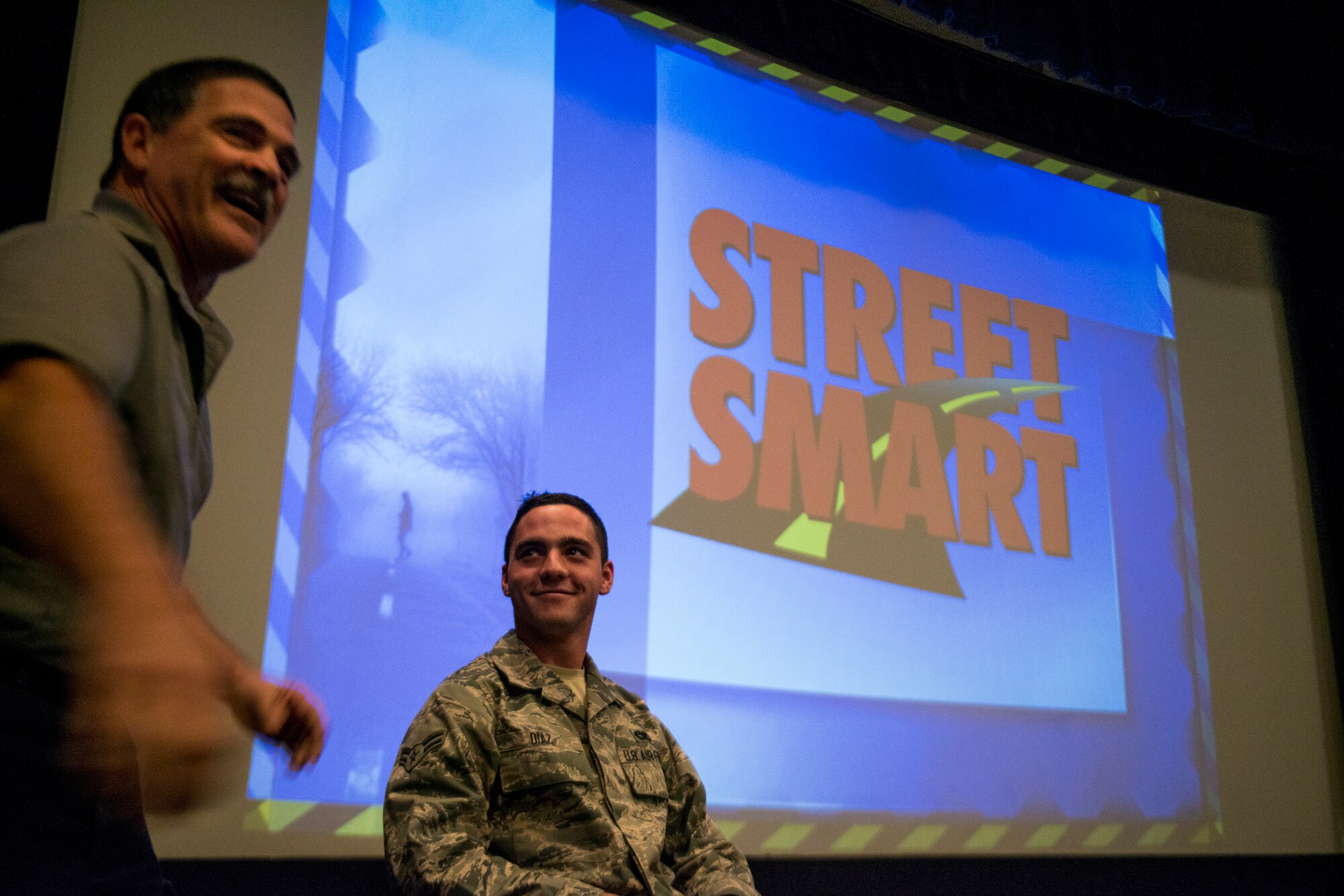 Ronny Garcia, Street Smart presenter and Tampa Fire Rescue fire captain, interacts with U.S. Air Force Airman 1st Class Anthony Diaz, 23d Logistics Readiness Squadron, during a Street Smart safety presentation Nov. 16, 2012, at Moody Air Force Base, Ga. Garcia took Diaz through a scenario, which involved him having a few drinks at a party and deciding to get behind the wheel of a car to demonstrate the results of drinking and driving. (U.S. Air Force photo by Staff Sgt. Jamal D. Sutter/Released) 