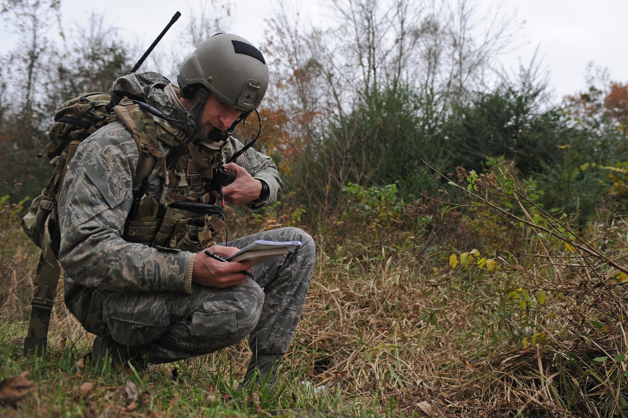 U.S. Air Force Airman 1st Class Kyle Gutowski, 682nd Air Support Operations Squadron joint terminal attack controller trainee, from Pope Army Air Field, N.C., reads coordinates to aircrew during a field training exercise at Creswell, N.C., Nov. 15, 2012. JTACs support ground forces in numerous overseas locations. (U.S. Air Force photo/Airman 1st Class John Nieves Camacho/Released)