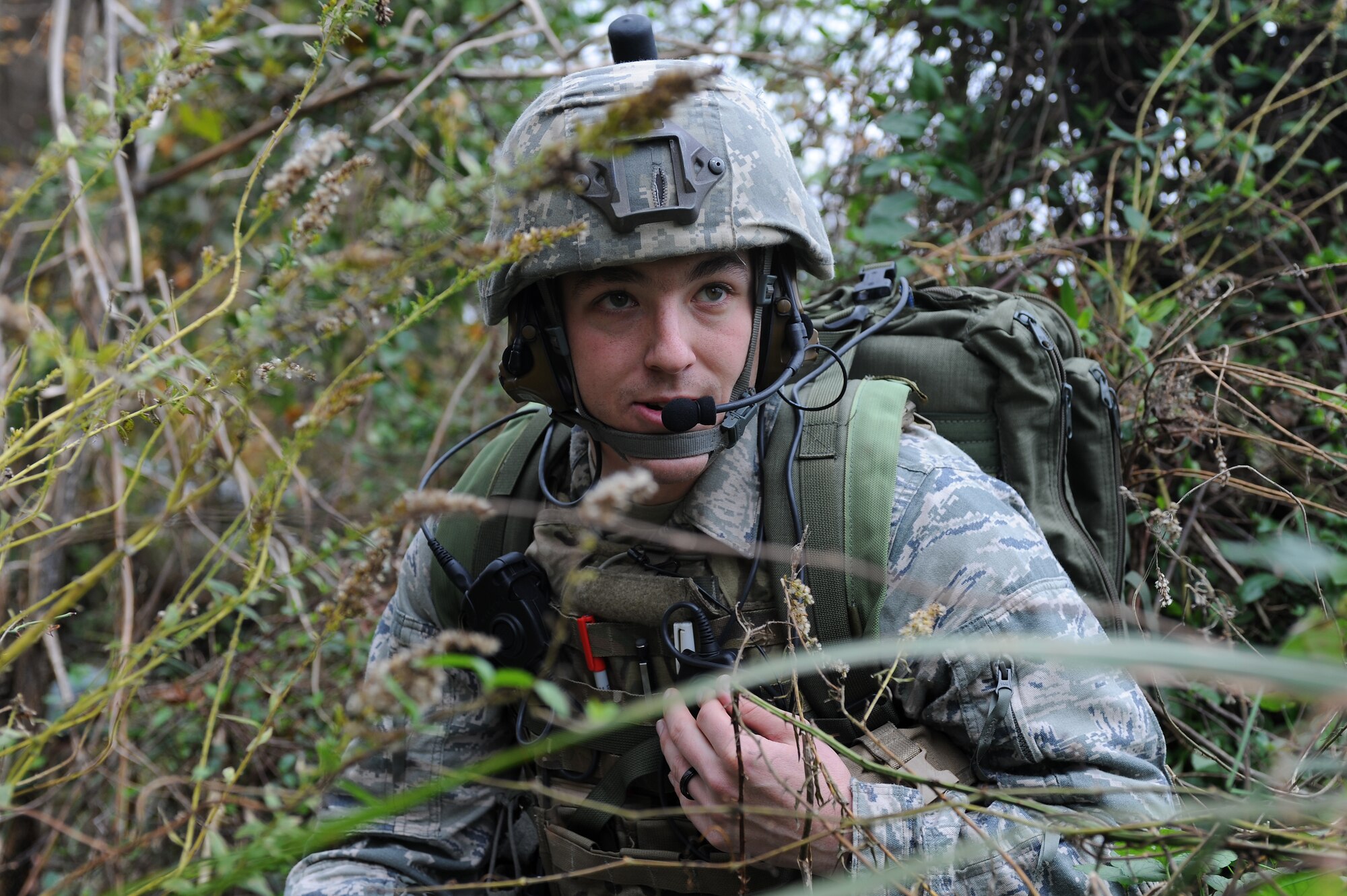 U.S. Air Force Tech. Sgt. Nicholas Burrell, 14th Air Support Operations Squadron joint terminal attack controller trainee, from Pope Army Air Field, N.C., communicates with aircrew during a field training exercise at Creswell, N.C., Nov. 15, 2012. The FTX occurred in a simulated wartime environment, demanding trainees to accurately coordinate with F-15E Strike Eagle aircrews from Seymour Johnson Air Force Base to destroy various targets. (U.S. Air Force photo/Airman 1st Class John Nieves Camacho/Released)