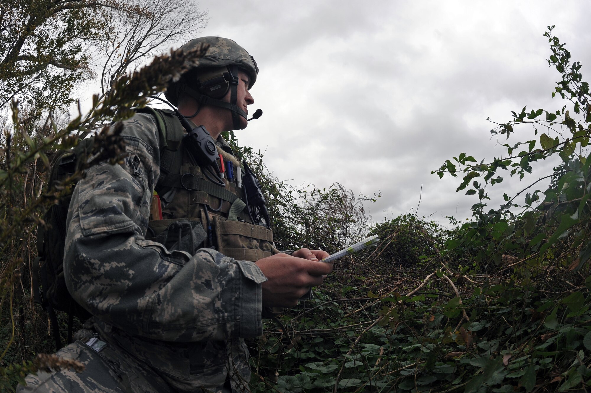 U.S. Air Force Tech. Sgt. Nicholas Burrell, 14th Air Support Operations Squadron joint terminal attack controller trainee, from Pope Army Air Field, N.C., scans the surrounding area during a field training exercise at Creswell, N.C., Nov. 15, 2012. JTACs act as air support liaisons between ground forces and aircrew members. (U.S. Air Force photo/Airman 1st Class John Nieves Camacho/Released)