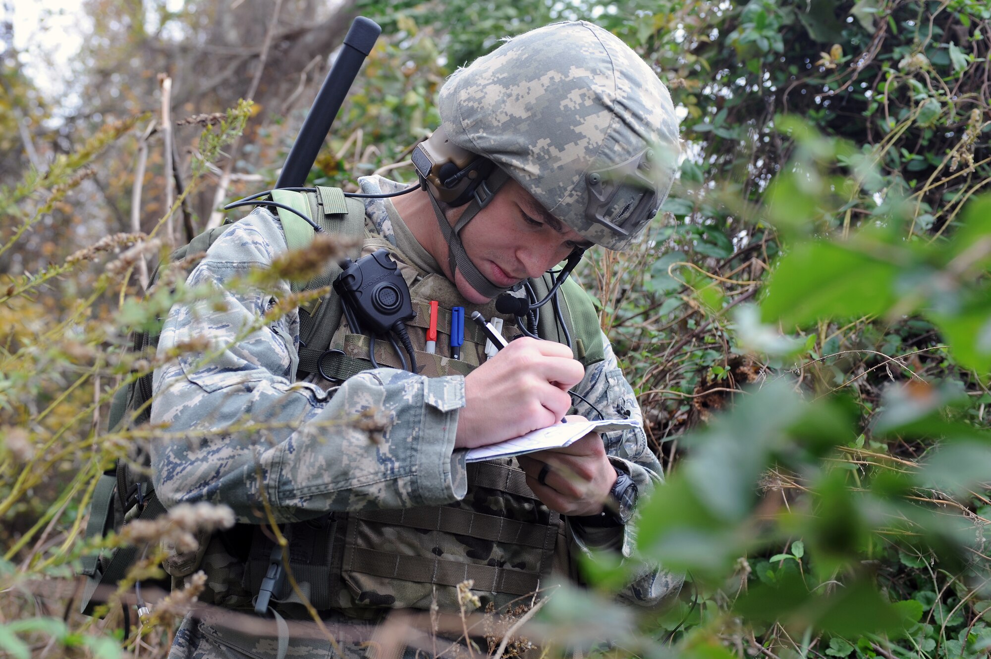 U.S. Air Force Tech. Sgt. Nicholas Burrell, 14th Air Support Operations Squadron joint terminal attack controller trainee, from Pope Army Air Field, N.C., annotates coordinates for a 9-Line report during a field training exercise at Creswell, N.C., Nov. 15, 2012. A 9-Line is a checklist JTACs use to gather information prior to requesting an airstrike. (U.S. Air Force photo/Airman 1st Class John Nieves Camacho/Released)