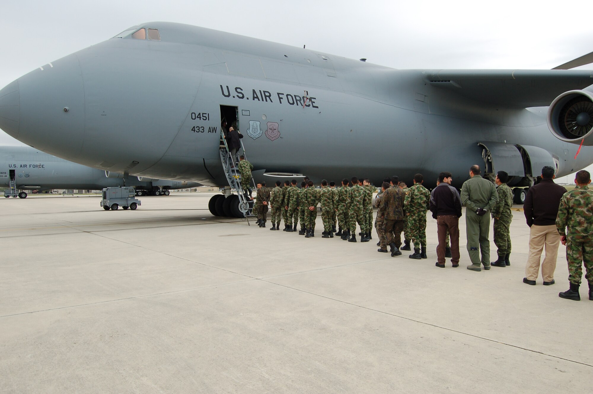 Over 100 students from the Inter-American Air Forces Academy, located at Joint Base San Antonio-Lackland, Texas, climb inside a massive C-5A Galaxy assigned to the 433rd Airlifit Wing, an Air Force Reserve unit also located at JBSA-Lackland on Nov. 15.  Since 1993, IAAFA students have visited the "Alamo Wing" maintenance shops as part of their aircraft-maintenance and logistics studies.  Since 1942, IAAFA has conducted international training in the Spanish language, forging ties with Latin American military, national police and governmental agencies. The school continues to remove language and cultural barriers by building partnerships between the U.S. and countries in the North and South American continents, Central America  and the Caribbean region.