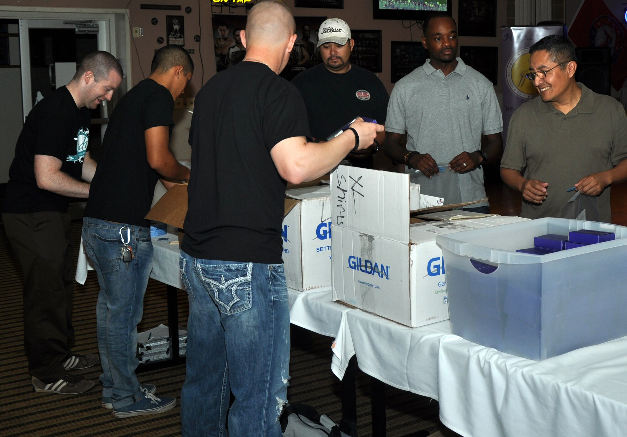 GOODFELLOW AIR FORCE BASE, Texas – Sexual Assault Prevention and Response members hand out game chips to participants of Guys Night Out at the Event Center here Nov. 10. There was a casino theme for this Guys Night Out. (U.S. Air Force photo/ Airman 1st Class Joshua Edwards)