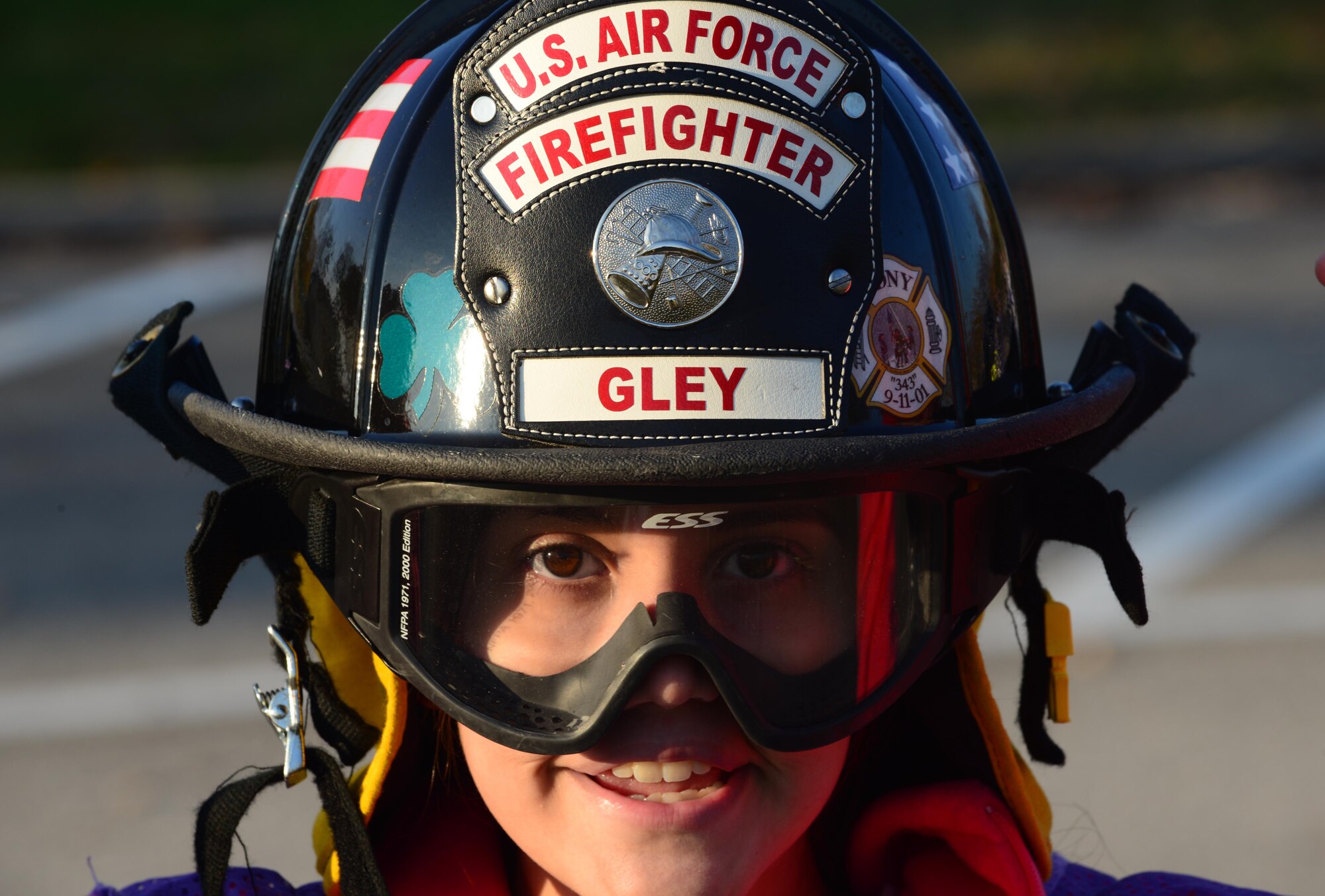 A child participating in the deployment camp, tries on a firefighter’s helmet at Aviano Air Base, Italy, Nov. 17. Several squadrons such as 31st Operations Support Squadron, 31st Civil Engineer Squadron, 31st Force Support Squadron, 31st Logistics Readiness Squadron, chapel and public health staffs and legal services helped volunteer with the deployment to give the children the feel of what their military family members go through during a deployment. (U.S. Air Force photo/Airman 1st Class Matthew Lotz) 