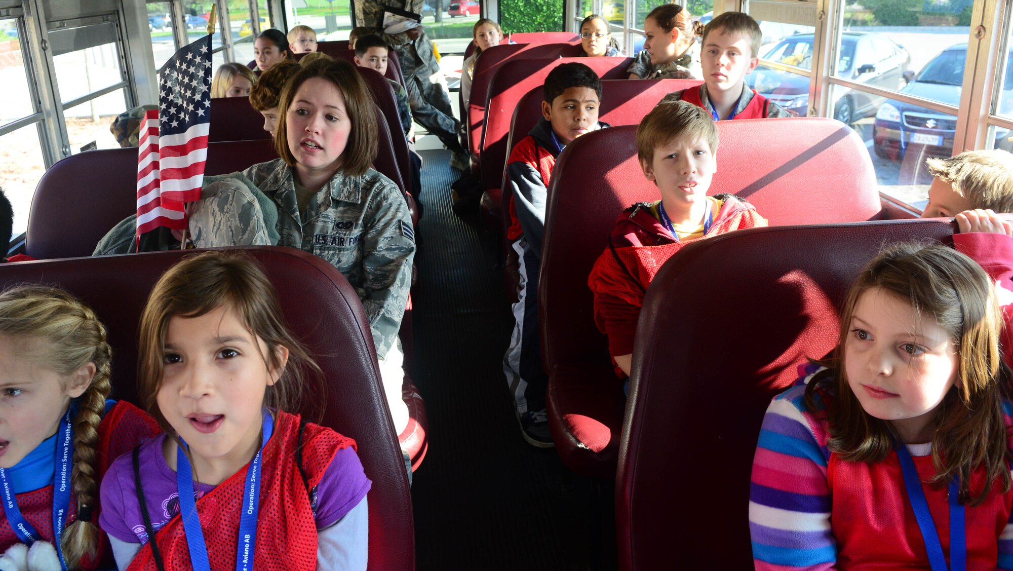 Simulated troops load a bus during the deployment camp at Aviano Air Base, Italy, Nov. 17. The base hosted a 2-day mock deployment camp for a group of 9 to 15-year-old kids to give them the feel of what their military family members go through during a deployment. More than 40 children participated in several different events from learning how to march to completing an obstacle course. (U.S. Air Force photo/Airman 1st Class Matthew Lotz) 
