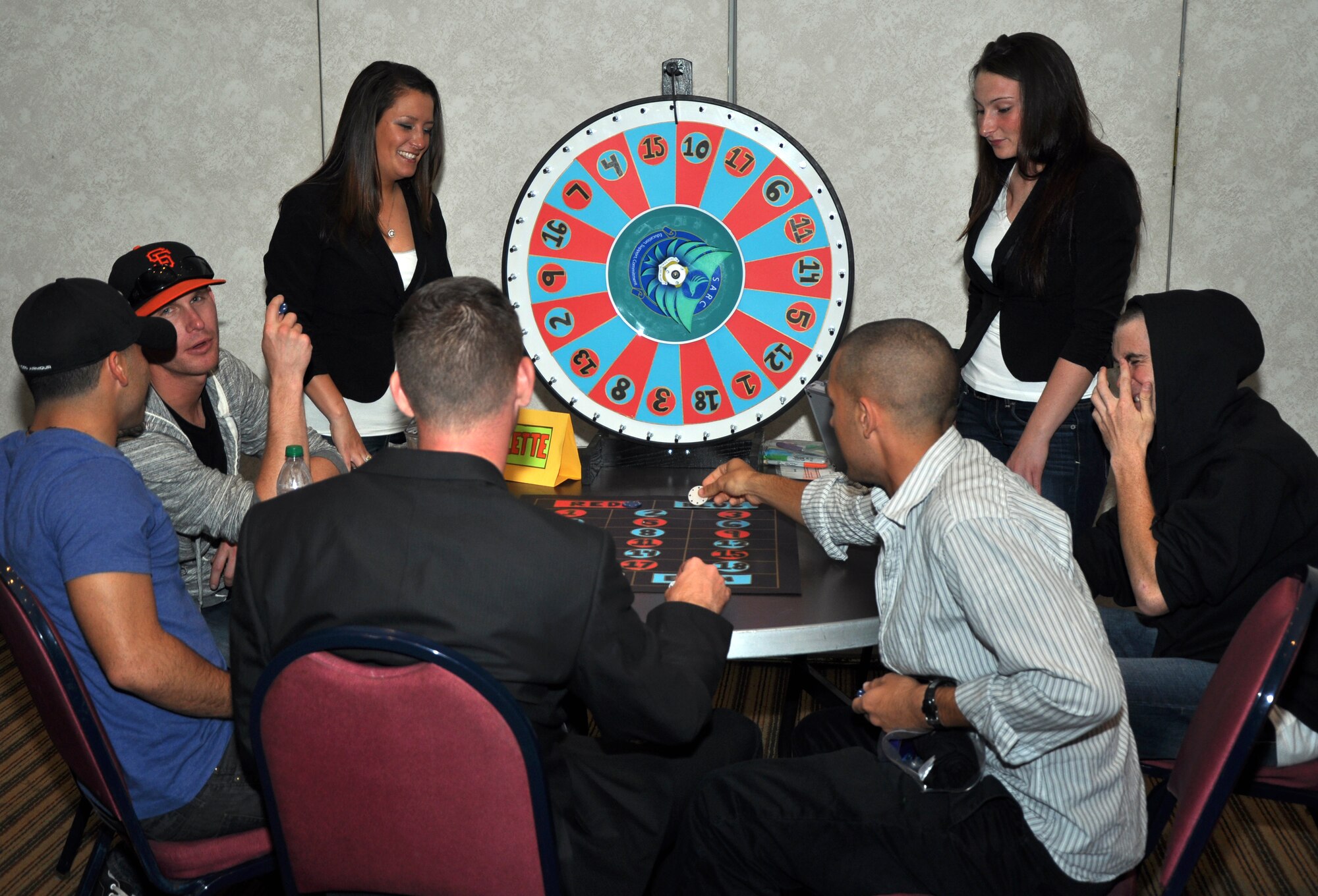 GOODFELLOW AIR FORCE BASE, Texas – Several participants of Guy Night Out place their bets for the roulette wheel at the Event Center Nov. 10. All the games at Guys Night Out were free of charge. (U.S. Air Force photo/ Airman 1st Class Joshua Edwards)