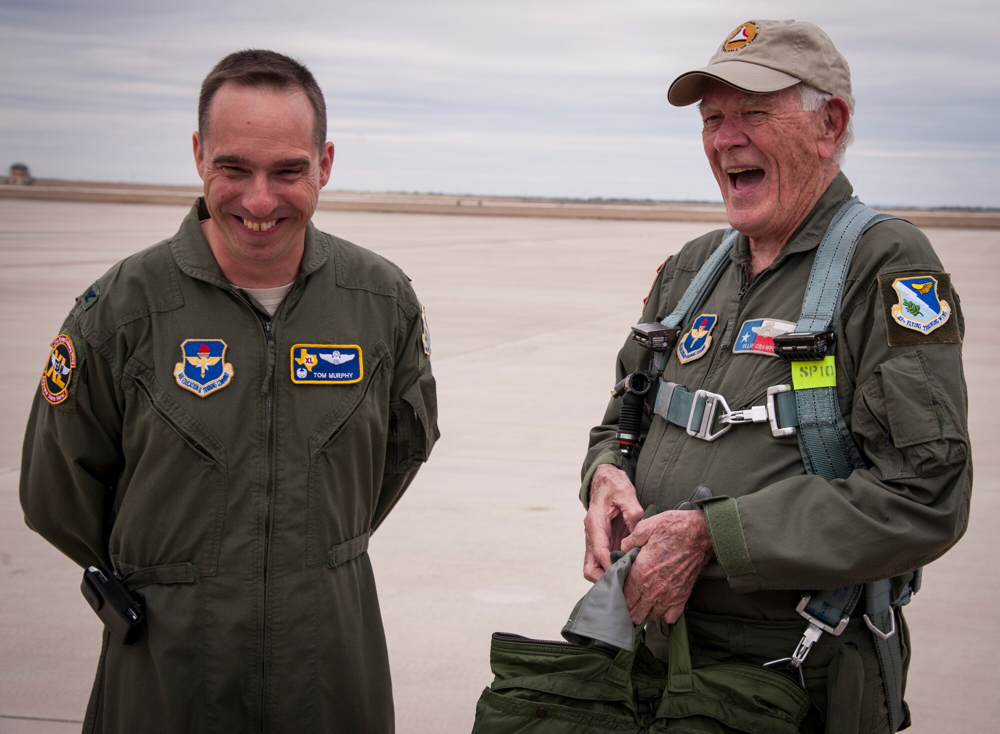 Oliver “Ollie” Crawford, an American airpower legend, shares a joke with Col. Tom Murphy, 47th Flying Training Wing commander, after his flight in a T-38 Talon from Laughlin Air Force Base, Texas, Nov. 16, 2012. Crawford was invited to speak with Laughlin’s latest class of graduating pilots and then flew with the 87th Flying Training Squadron in a T-38. (U.S. Air Force photo/Airman 1st Class Nathan Maysonet)  