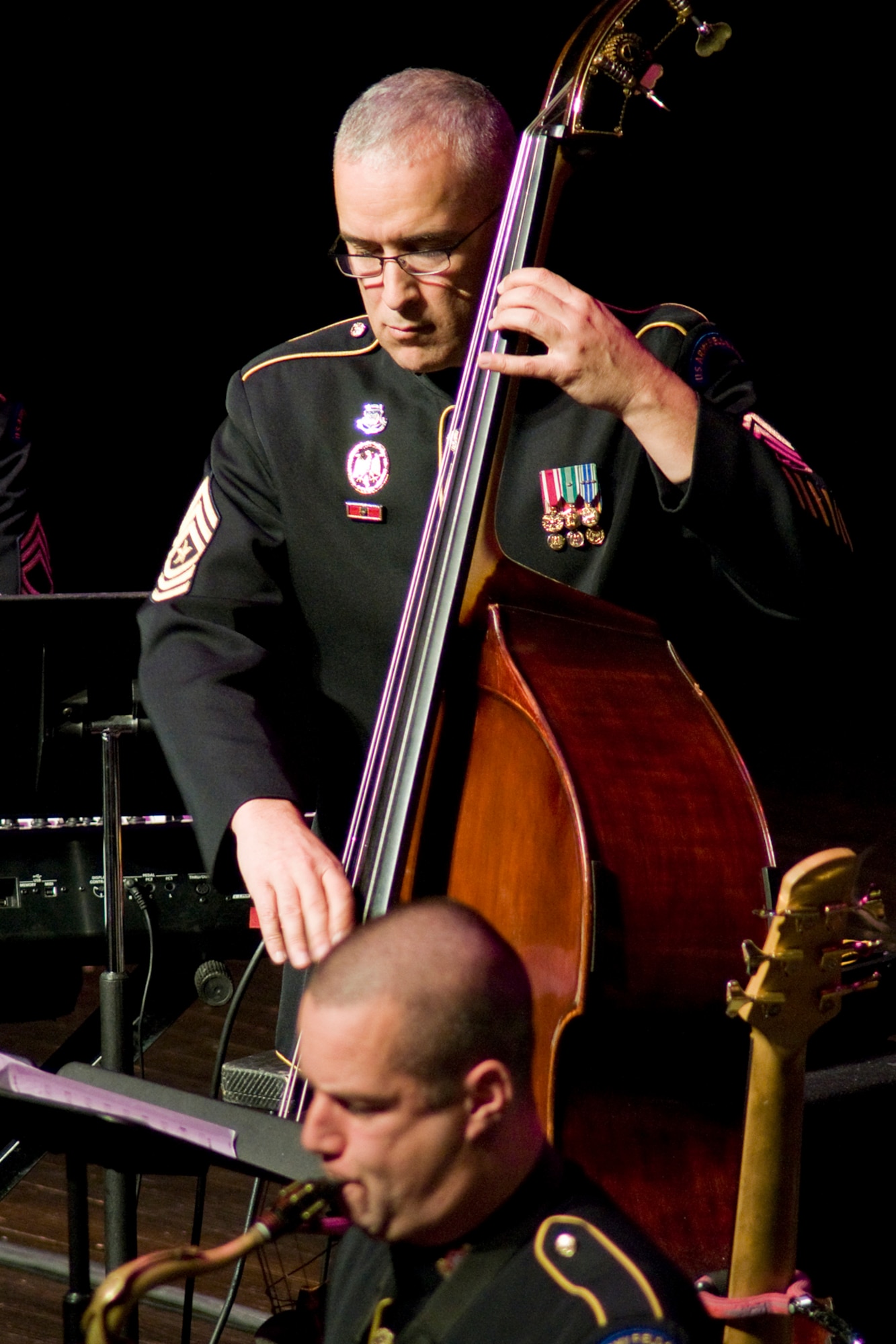 GRISSOM AIR RESERVE BASE, Ind. -- U.S. Army Field Band Sgt. Maj. Jeffrey Lopez plays bass during a special Veterans Day concert held at the Honeywell Center in nearby Wabash, Ind., Nov. 12. The organization's four performing components, the Concert Band, the Soldiers' Chorus, the Jazz Ambassadors and the Volunteers, each travel over 100 days annually. (U.S. Air Force photo/Tech. Sgt. Mark R. W. Orders-Woempner)
