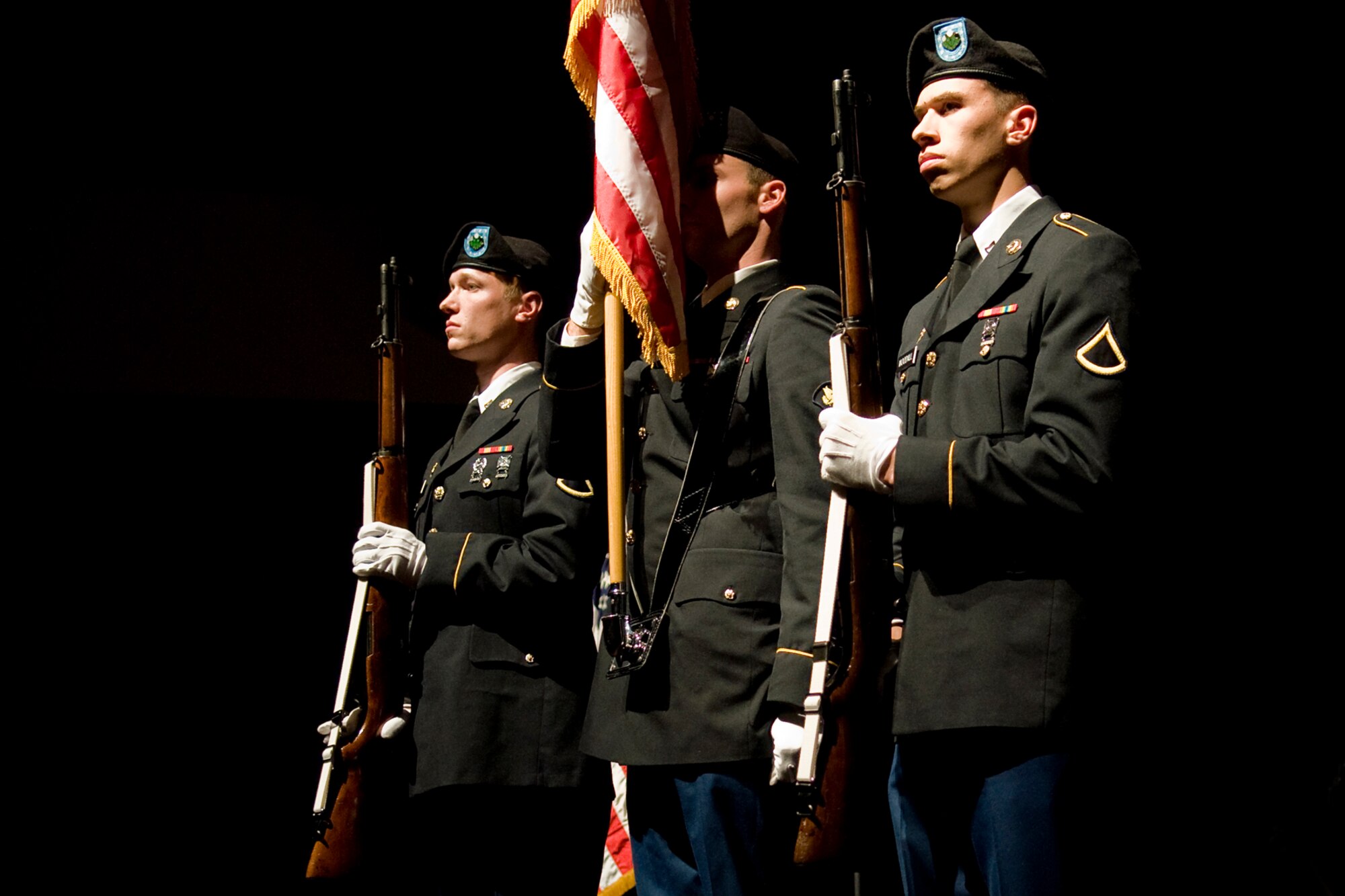 GRISSOM AIR RESERVE BASE, Ind. -- Soldiers from the U.S. Army Reserve's 316th Tactical Psychological Operations Company at Grissom present the Colors at the start of a special Veterans Day concert at the Honeywell Center in nearby Wabash, Ind., Nov. 12. From left are Pfc. Michael Klingsmith, Spc. Fayne Lawson and Pfc. Alexander Woodall. (U.S. Air Force photo/Tech. Sgt. Mark R. W. Orders-Woempner)

