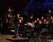 Chief Warrant Officer 2 Denny Saunders takes a bow after conducting the opening number, "The Footlifter," during the Utah National Guard's 57th annual Veterans Day concert at the University of Utah's Jon M. Huntsman Center, Nov. 10. Saunders led the Utah National Guard's 23rd Army Band and a 600-voice combined choir from Granite School District high schools through several numbers during the evening event. (U.S. Air Force photo by Senior Airman Lillian Harnden)(RELEASED)
