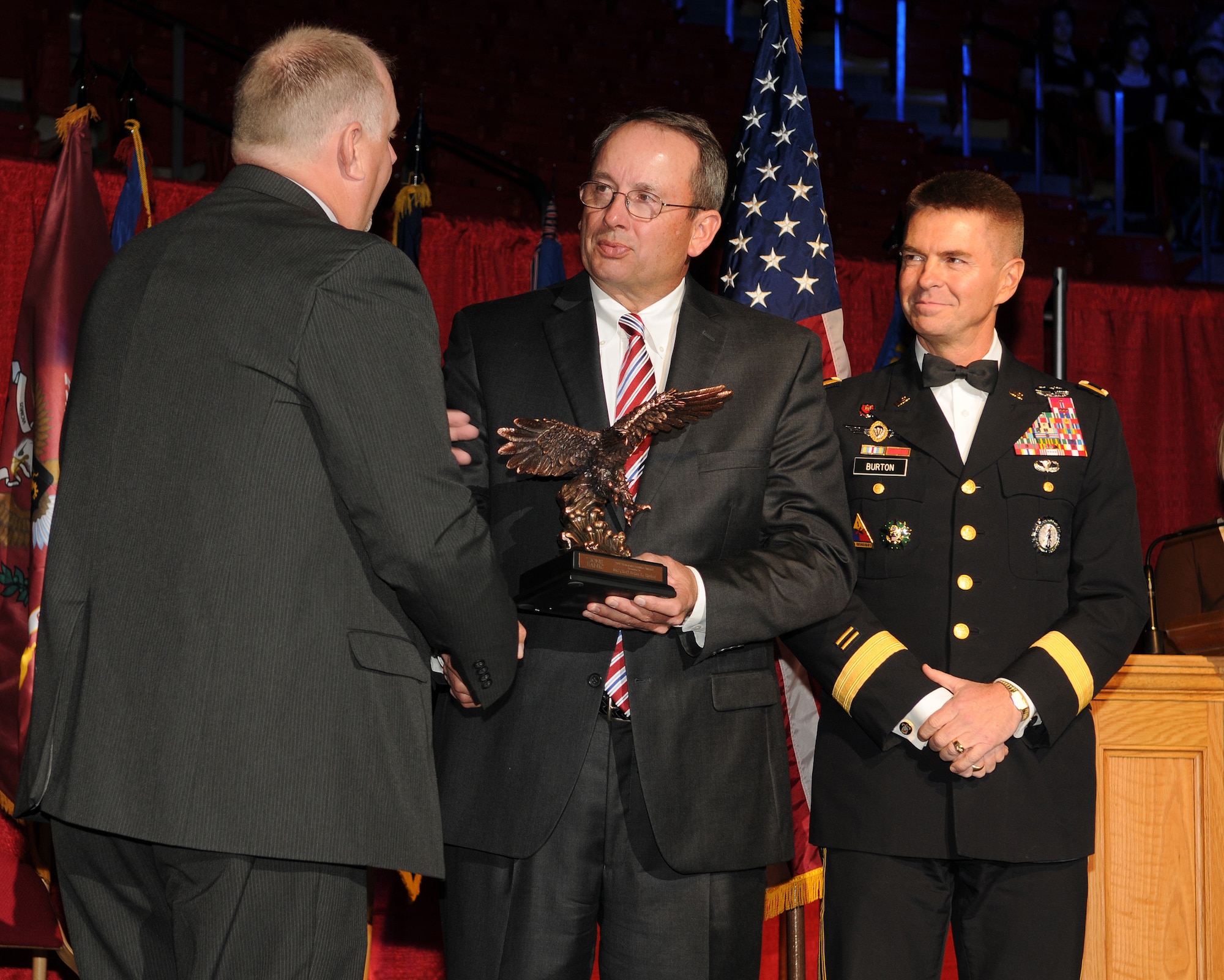 Retired Maj. Gen. Brian Tarbet, the former adjutant general of the Utah National Guard, was awarded the Veterans Service Award by Zions Bank for his lifetime of service and support of military veterans during the 57th annual Veterans Day concert at the University of Utah's Jon M. Huntsman Center, on Nov. 10. (U.S. Air Force photo by Senior Airman Lillian Harnden)(RELEASED)